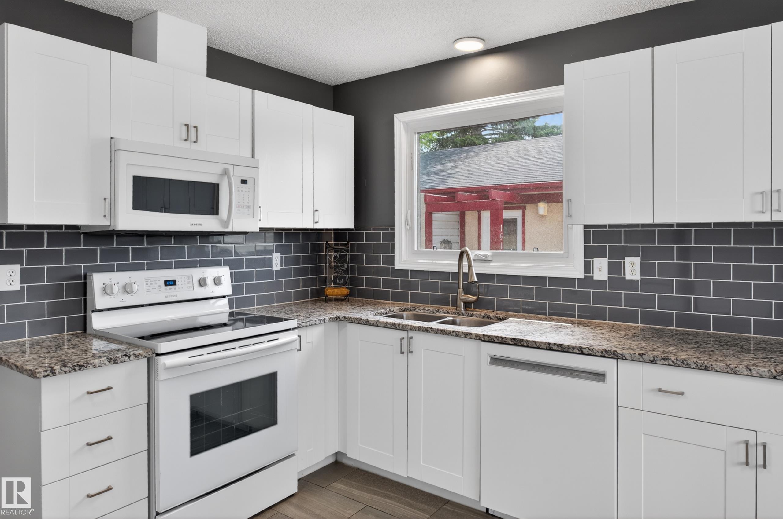 Photo 15 at 15115 22 Street NW, Fraser, Edmonton