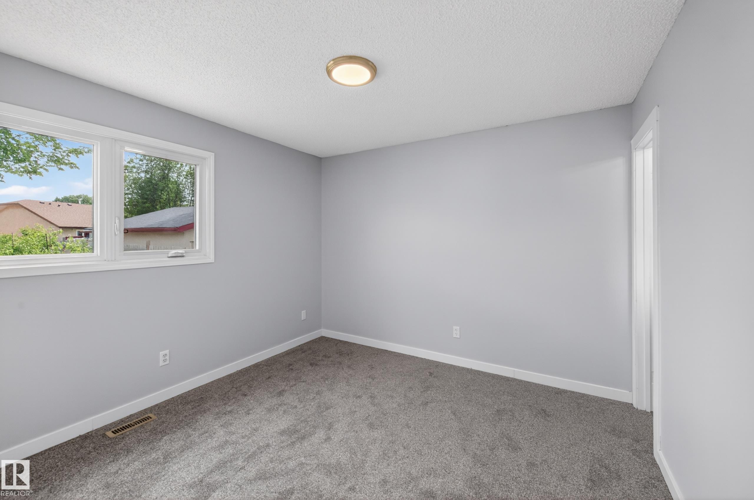 Photo 23 at 15115 22 Street NW, Fraser, Edmonton
