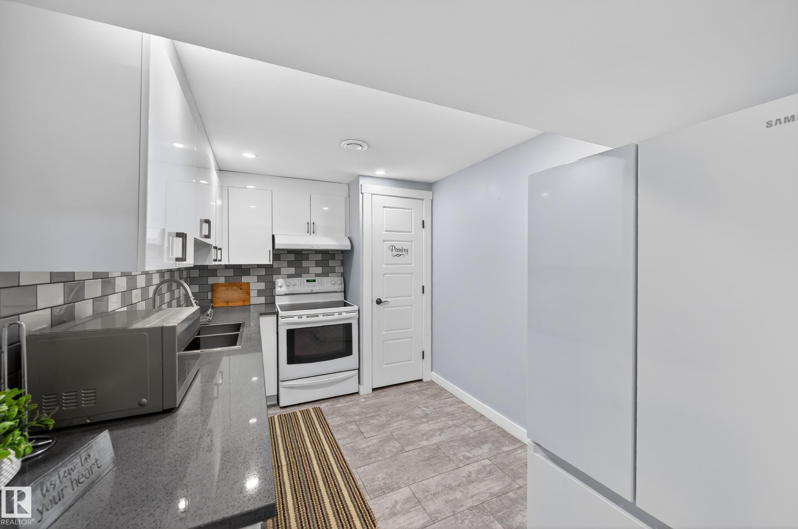 Photo 45 at 15115 22 Street NW, Fraser, Edmonton