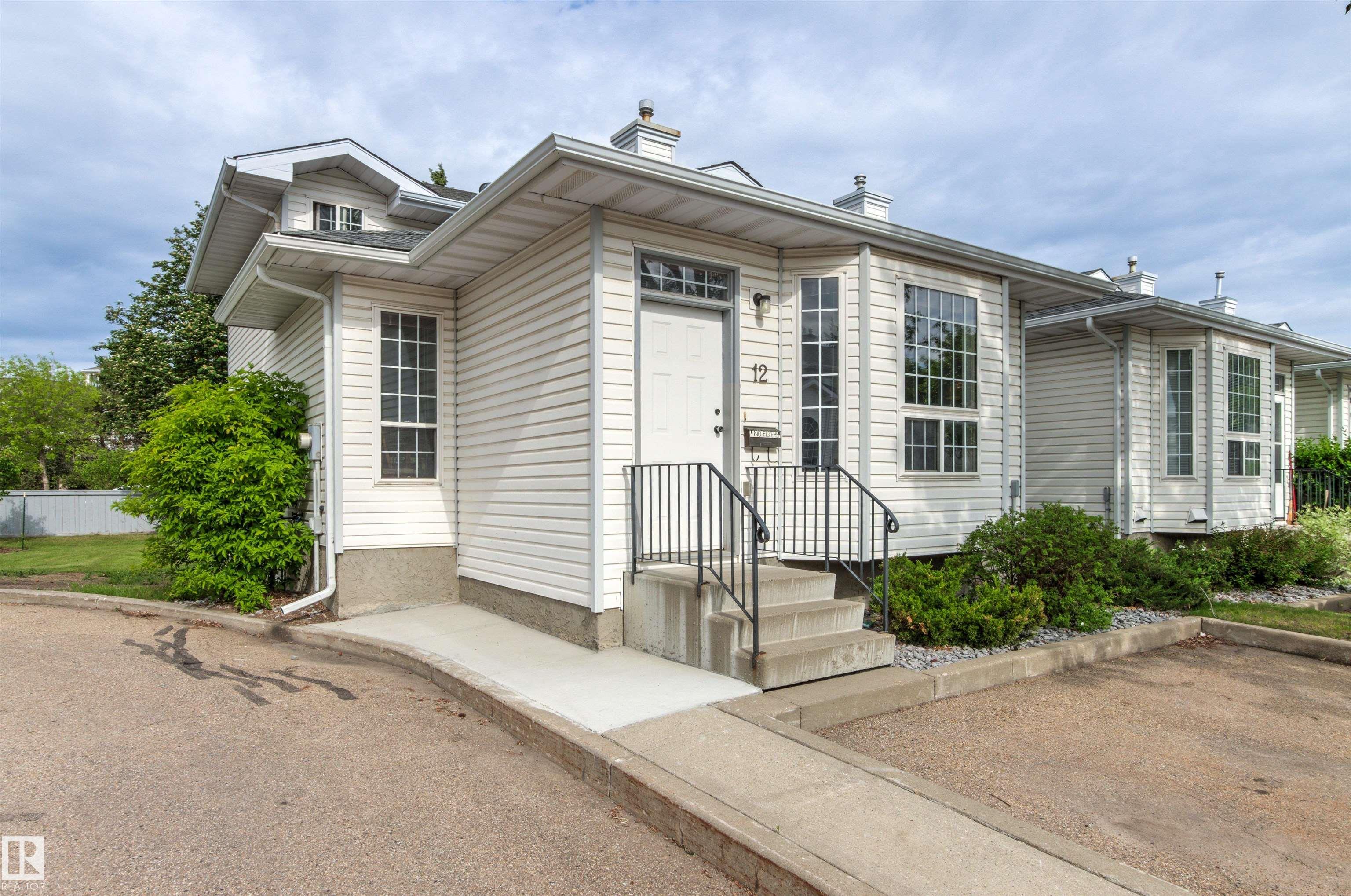 Spacious End-Unit Townhome in Desirable Tawa! This unique 4-level split offers exceptional space and versatility in an unbeatable location. The bright main floor features a sun-filled living room, generous dining area, and functional kitchen with a brand-new microwave and stove less than a year old. Upstairs, you?ll find a huge primary bedroom with a large walk-in closet, a second spacious bedroom, and a full bath. The third level is perfect for relaxing or entertaining, boasting a large family room with a cozy gas fireplace, a den area, a second full bathroom, and patio doors leading to your private deck. The partially finished fourth level includes a den, potential third bedroom, laundry/mechanical room, and an enormous crawlspace for all your storage needs. Recent updates include a 2-year-old hot water tank, newer stove, and brand-new microwave. Ideally located within walking distance of Grey Nuns Hospital, Mill Woods Town Centre, and the LRT, this home combines comfort, convenience, and value.