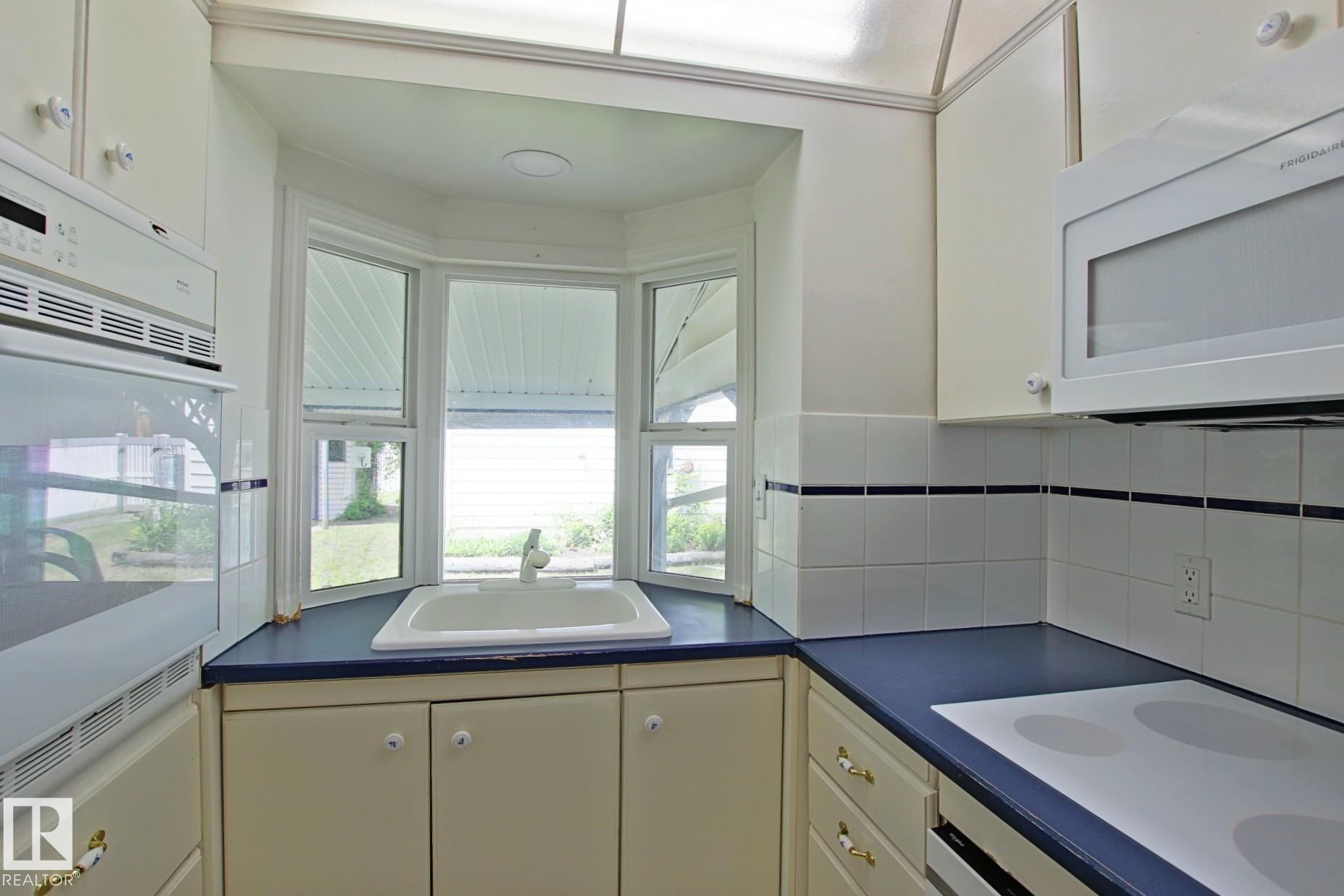 Photo 8 at 11242 56 Street NW, Highlands, Edmonton