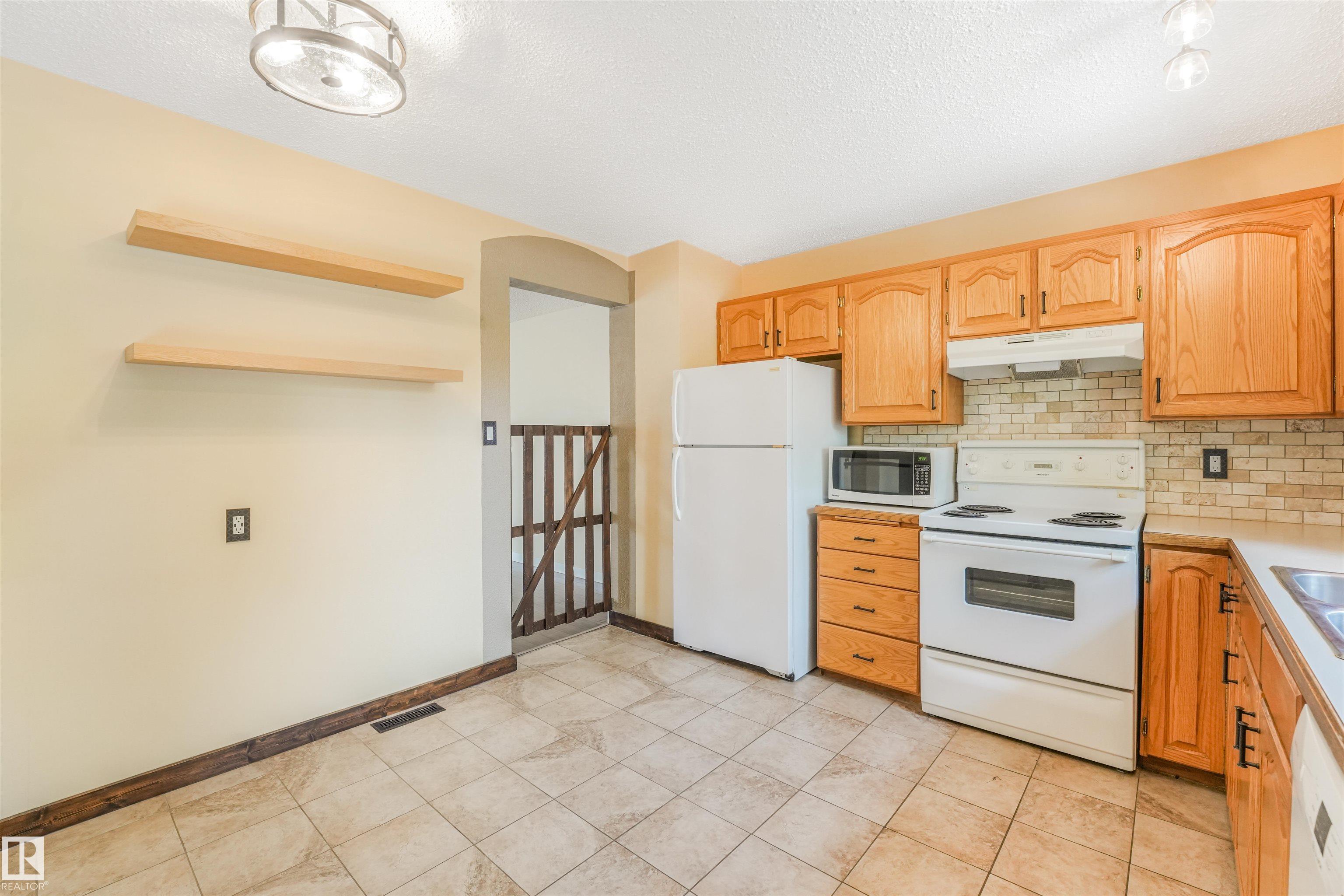 Photo 13 at 2921 130 Avenue NW, Belmont, Edmonton