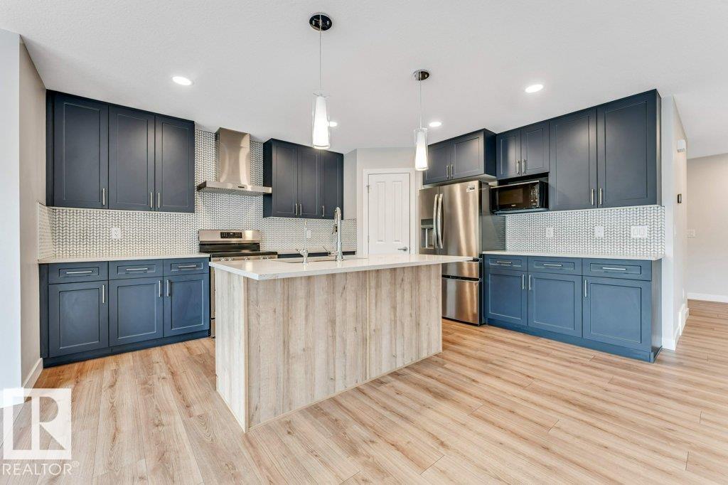 Photo 3 at 403 35 Avenue NW, Maple Crest, Edmonton