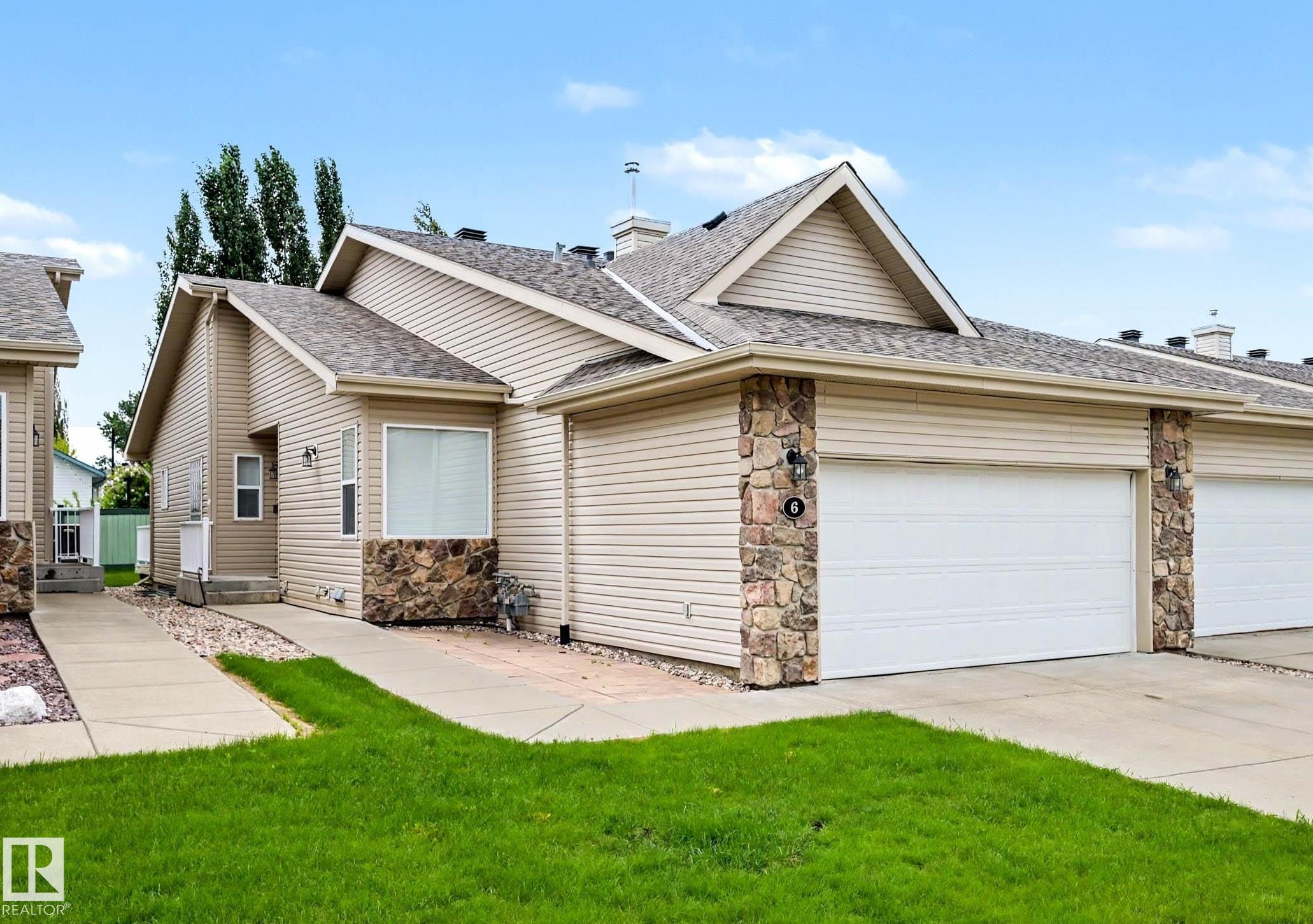 Photo 2 at 6 - 2031 Brennan Crescent NW, Breckenridge Greens, Edmonton