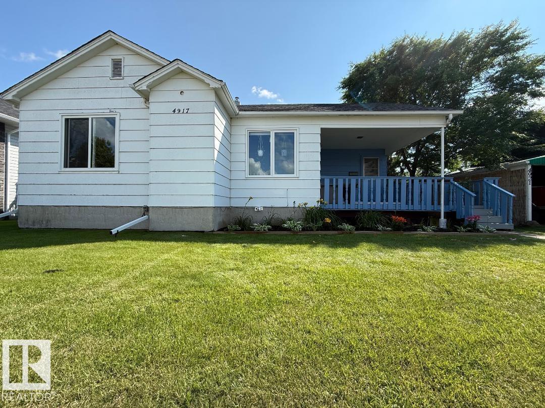 South side Bungalow! The original portion of this family home was built in 1945. With the 1978 addition of a kitchen, living room, hallway, 2 piece bath as well as a new basement (YES! TWO BASEMENTS!), they have combined to make this 4 bedroom home a very appealing floor plan with full dining room and BIG living room! Upgrades in recent years include: kitchen cupboards, counter tops, back splash appliances, paint, flooring, lighting fixtures, furnace, majority windows, shingles, deck and landscaping. . Also the one basement newly finished with den, storage, bedroom with walk in closet. the other is laundry, utility and more storage! The yard is awesome and HUGE! Fully fenced with MAJOR parking for Vehicles and RV or room to build a garage! Walking distance to swimming pools, ag. grounds, playgrounds and schools!