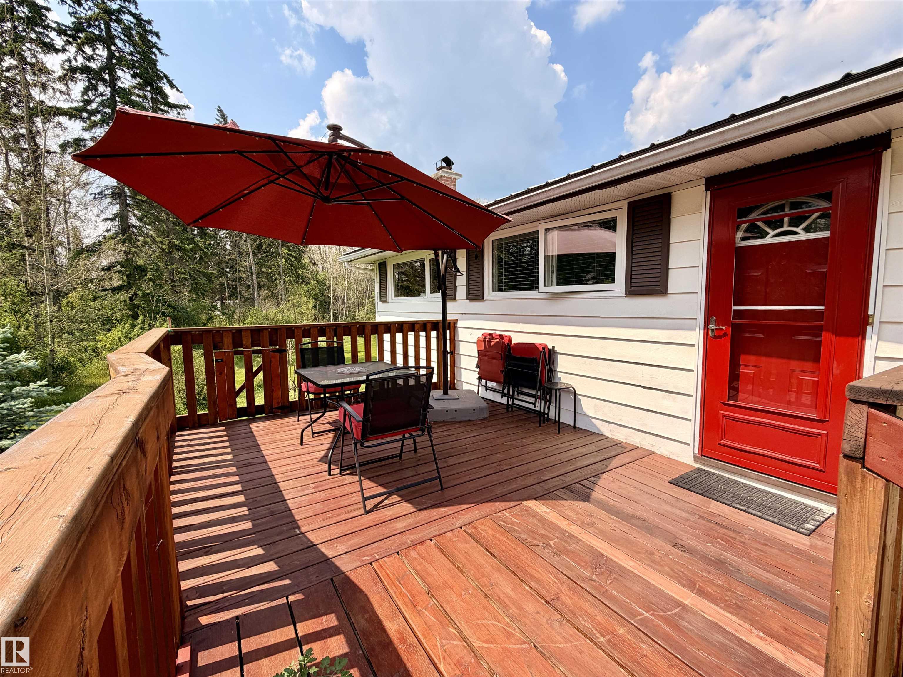 If you are dreaming of a move to the country to start a market garden business, this might be the one for you! This bungalow in Evansburg is situated on 1.83 acres within the town boundary and on town water. The home has been thoughtfully laid out and all available space is being maximized. The kitchen has a gorgeous feature wall done in brick and a tiled floor that carries into the dining room with a mediterranean feel. The owners combined 2 of the 3 bedrooms to make a Primary suite on the main floor and stole closet space from the hall to move a laundry pair upstairs for convenience. The bathroom on the main is 4 piece & in excellent condition. Basement has a bedroom, family room, bathroom & laundry. The vinyl windows and siding were updated in 2014, roof was tinned in 2010, and furnace & HWT were done in 2014. New decks, weeping tile, garden shed & arbour, 18 x 28 Workshop with power, Garden beds, & surface lease INCOME from a data centre that covers your taxes. So many extras-I can't list everything!