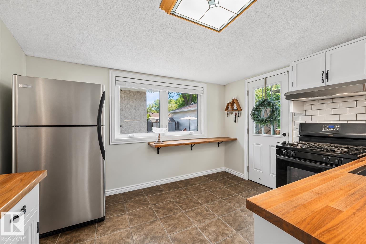 Photo 16 at 11328 65 Street NW, Highlands, Edmonton