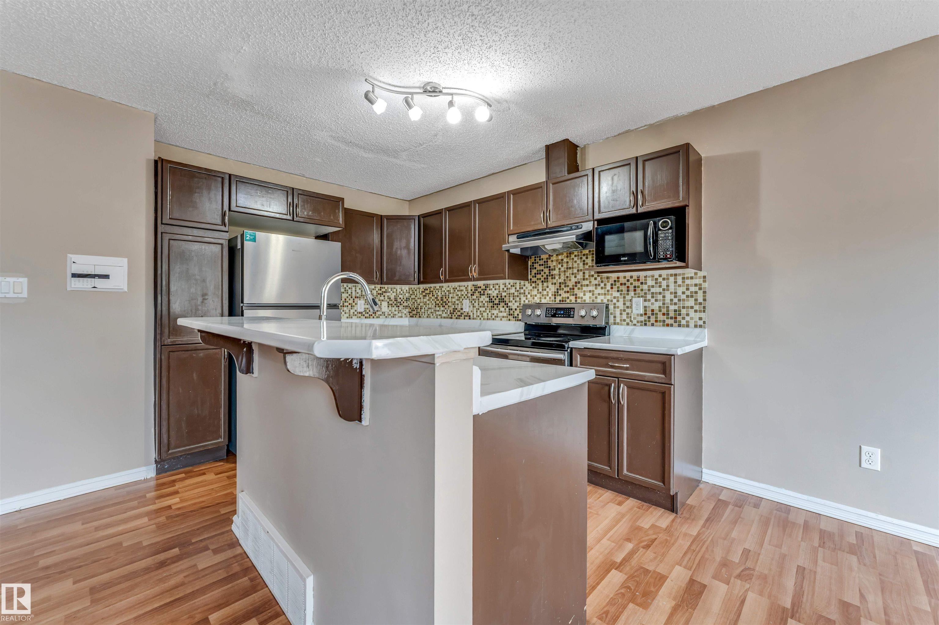 Photo 10 at 7743 8 Avenue SW, Ellerslie, Edmonton