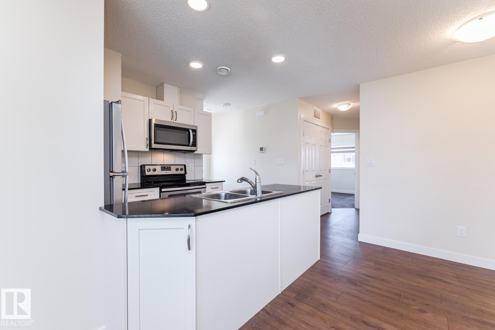 Photo 8 at 81 - 1530 Tamarack Boulevard NW, Tamarack, Edmonton