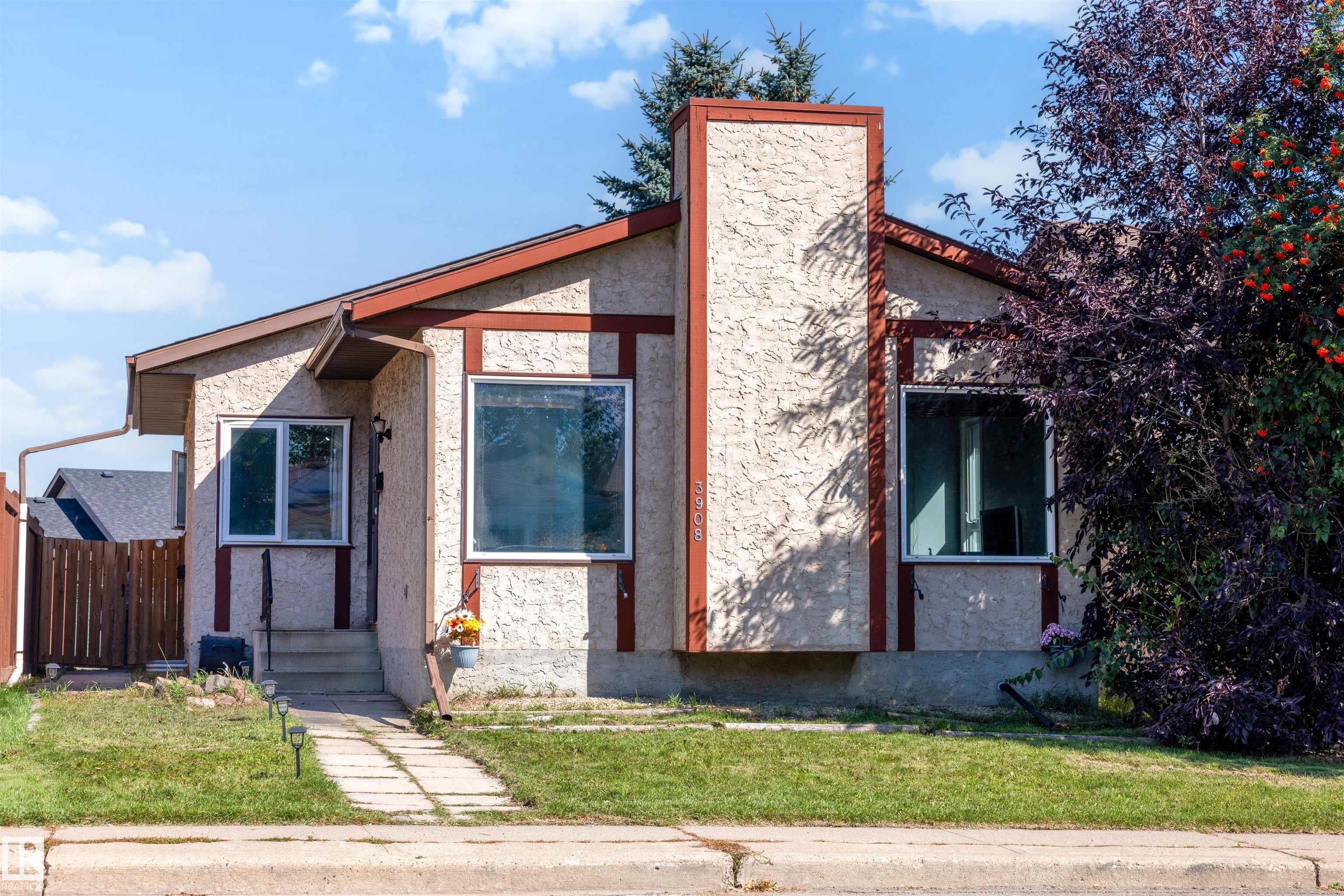 5 BEDROOMS + 2 KITCHENS + SEPARATE EXTERIOR ENTRANCE! This Kiniski Gardens bungalow offers plenty of finished living space across both levels. The main floor features a bright living room, eat-in kitchen, large primary bedroom, 2 additional bedrooms, full bathroom and convenient main-floor laundry. The fully finished basement features its own exterior entrance, second kitchen, generous living area, 2 additional bedrooms and another full bathroom. Several major updates have already been completed, including the roof, furnace, hot water tank and flooring, taking care of important big-ticket items. Outside you'll find a mature yard in an established southeast Edmonton neighbourhood. Close to schools, parks, playgrounds, shopping, transit and everyday amenities. With 5 bedrooms, 2 bathrooms, 2 kitchens and extensive finished space, this home offers an impressive amount of room throughout.