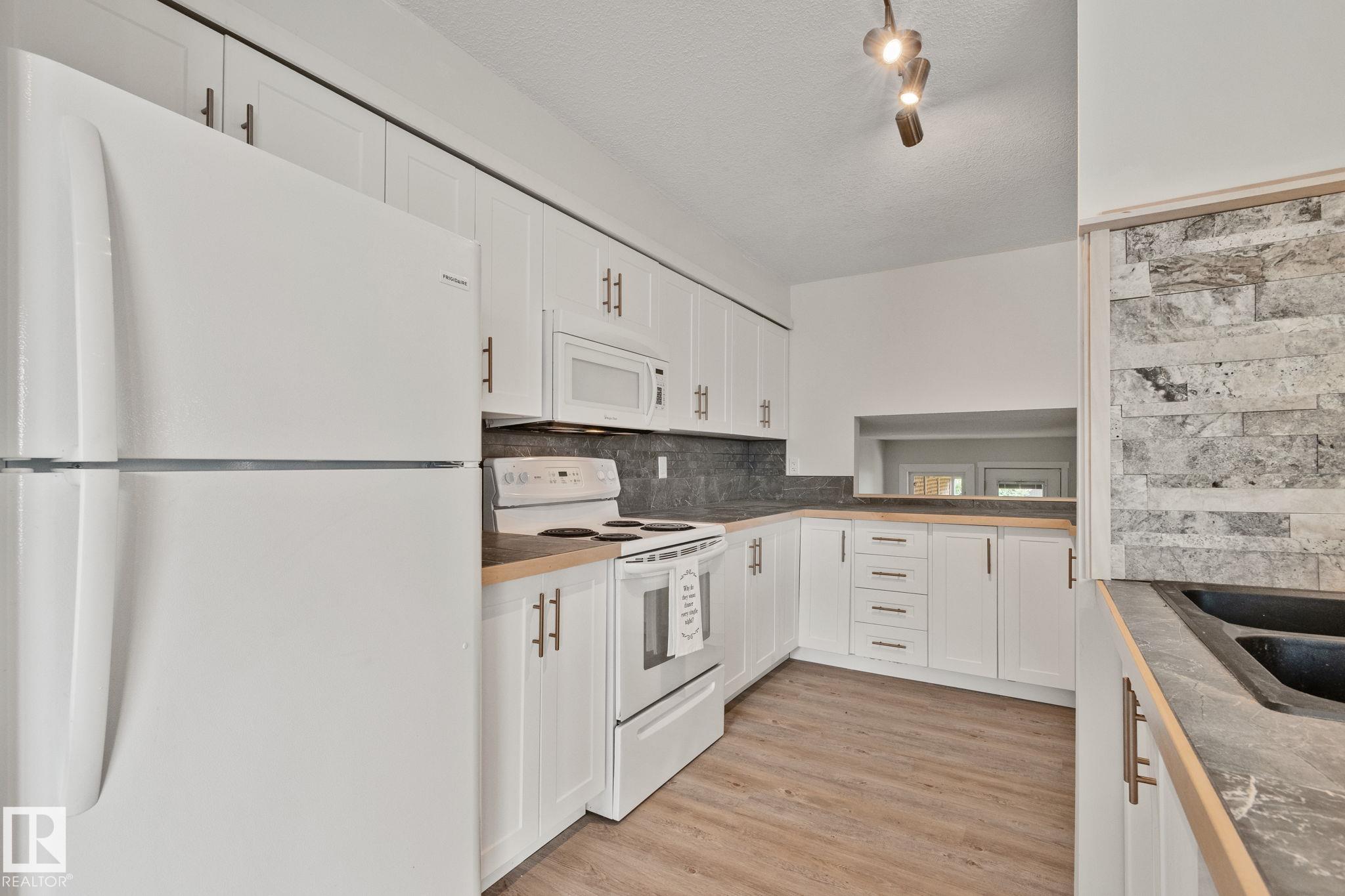 Photo 11 at 703 Grandin Drive, Morinville