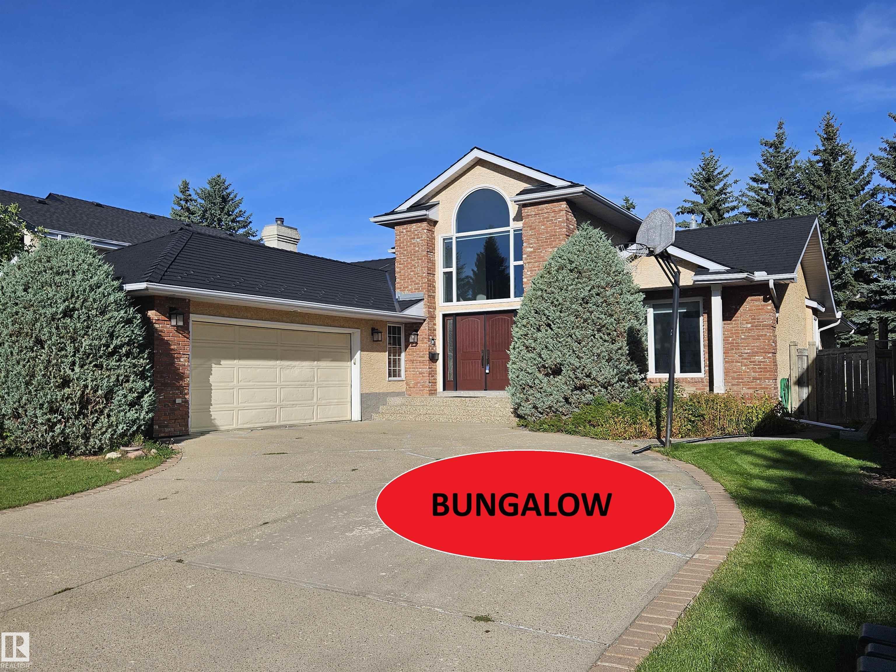 Customer-Built BUNGALOW sprawling across 5,200+ sq. ft. of executive living space, this home on Wheeler road offers a rare footprint in Edmonton's most sought-after community. The bright, open main floor features gas fireplaces in living room, a vaulted foyer, a dedicated office, and a bonus upper loft. Enjoy a gourmet quartz kitchen with stainless steel appliances, large pantry and breakfast nook. Primary bedroom complete with gas fireplace, expansive windows for tons of light, walk in closet and ensuite with steam shower. The massive finished basement offers tons of living space for large families with a huge rec room, 2 bedrooms, and 2 full baths plus TONS of storage. The location can't be beat with Country Club golf course, river valley access, parks and walking paths all steps away. Complemented by a private QUIET yard and a new EUROSHIELD roof.