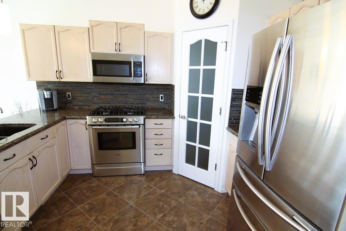 Photo 10 at 3115 135 Avenue NW, Belmont, Edmonton
