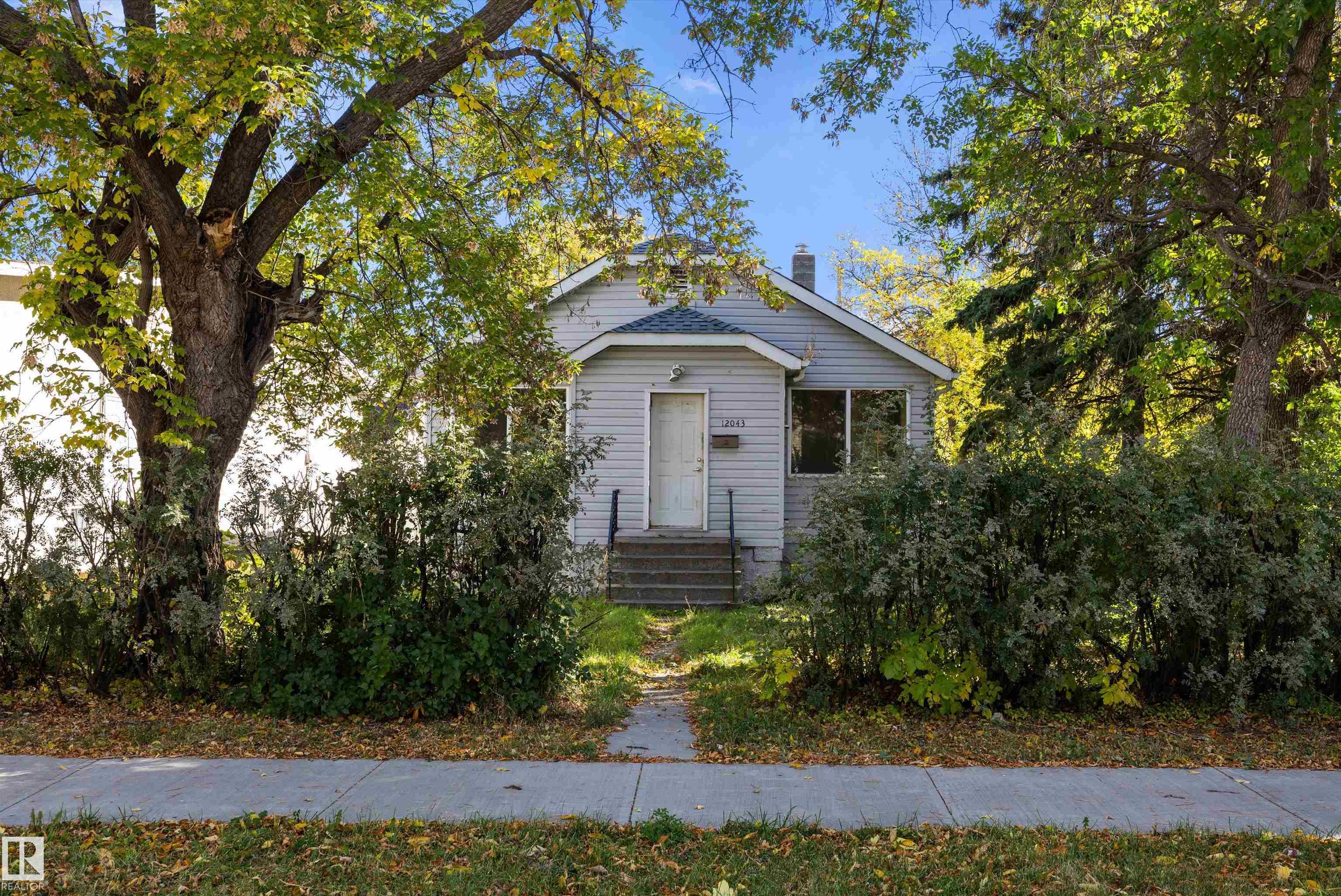INVESTOR ALERT! This property is being sold as LOT VALUE ONLY. The condition of the house is EXTREMELY ROUGH and a true FIXER UPPER. 50' x 150' lot with mature trees, a parking pad & a room for a garage. Great opportunity to build a multi unit on the lot. Don't miss this opportunity to own or invest in a property. Property is being sold, as is, where is.