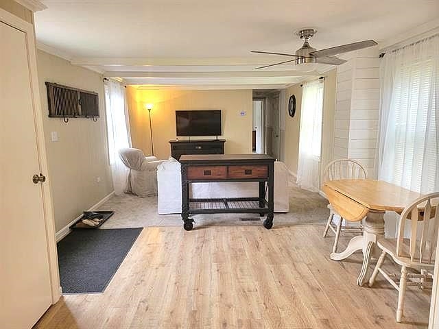 The home features updated flooring(2021+/-)