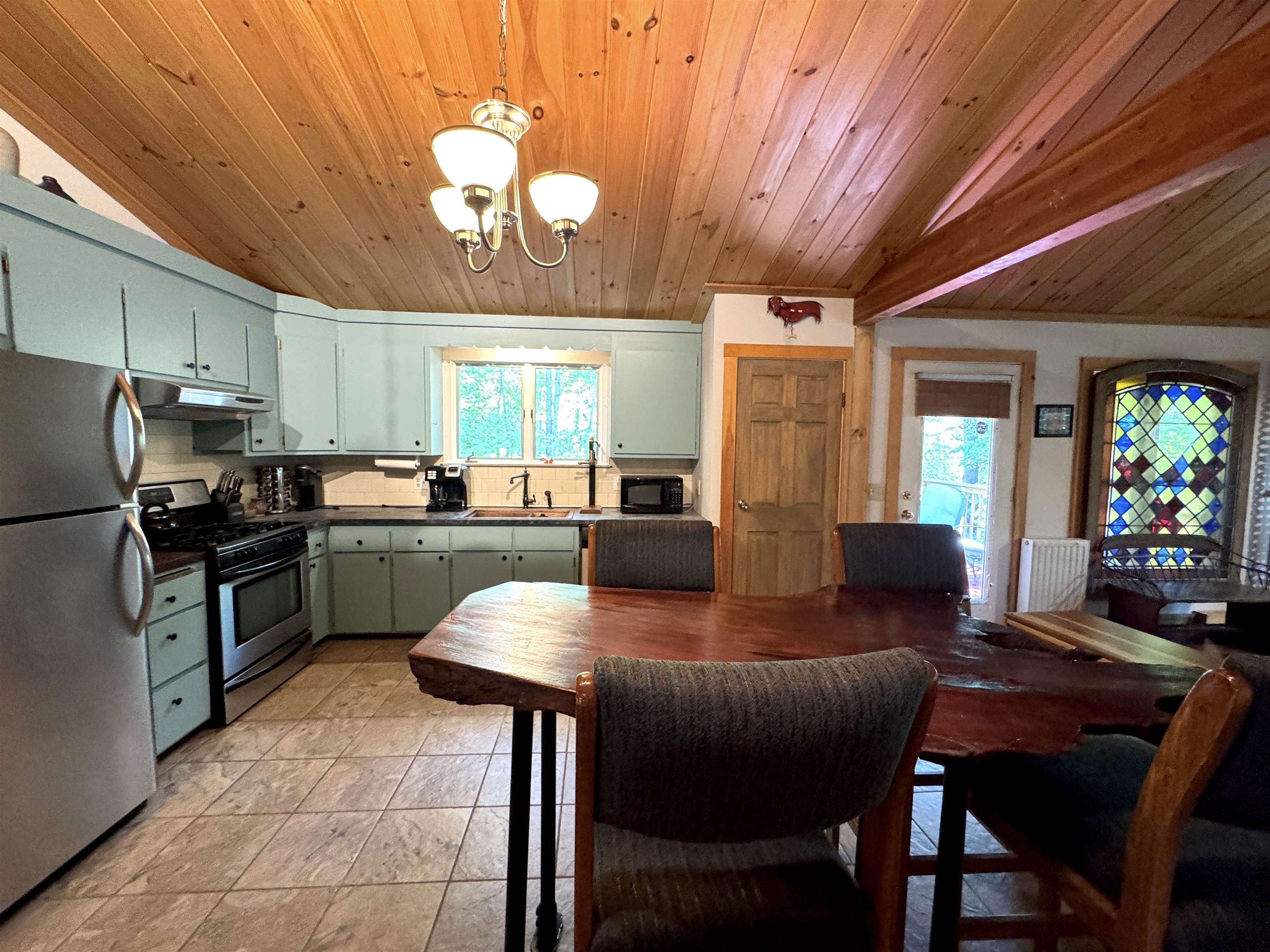 Live edge bar-height dining table - perfect for après-ski meals and conversation.