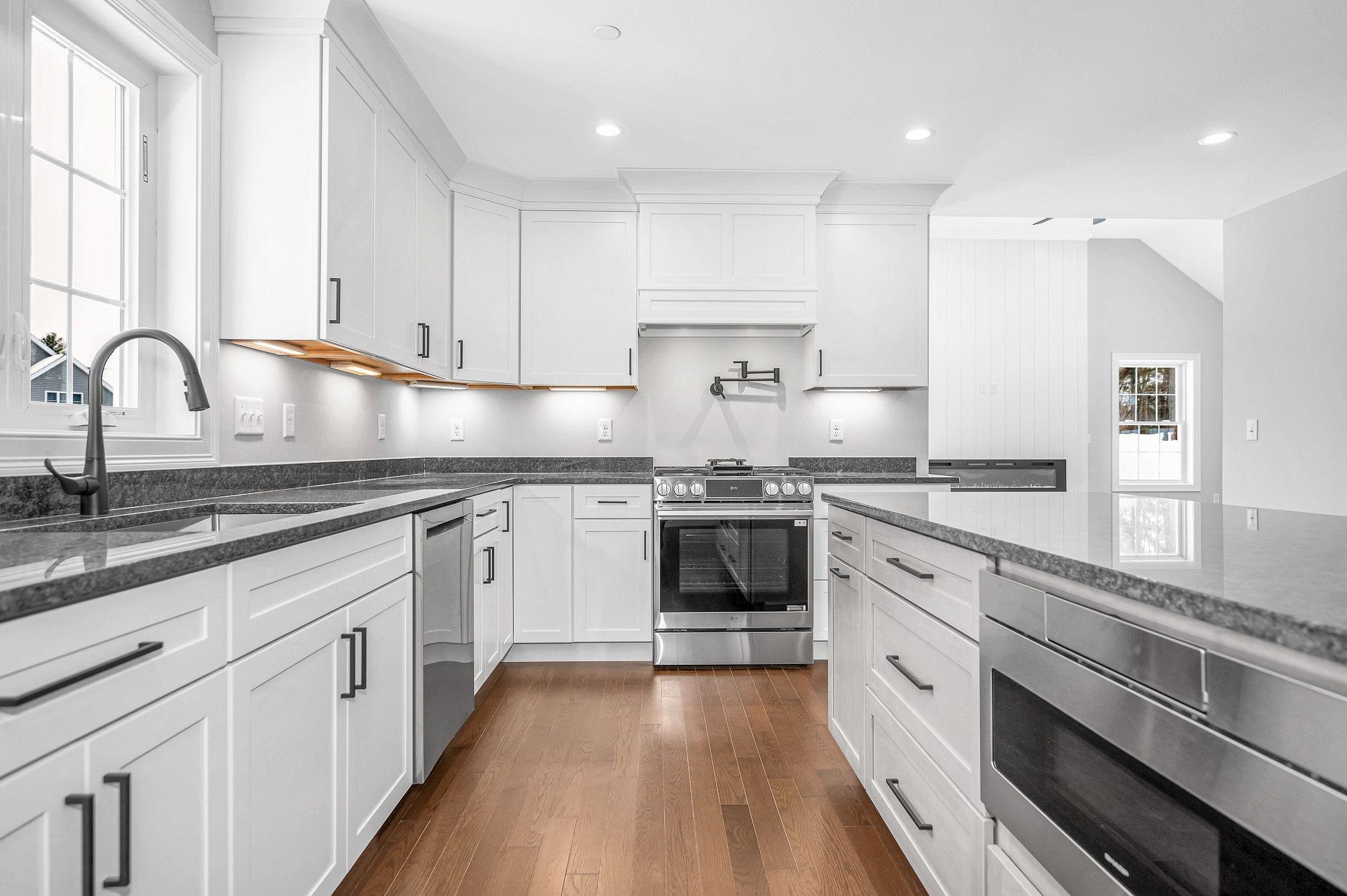 Construction Now Complete! Welcome to this brand-new, move-in-ready Colonial perfectly situated on a quiet dead-end street in a desirable neighborhood setting. Set on 1.01 acres, this stunning 8-room, 4-bedroom, 2.5-bath home blends classic New England design with refined modern touches.  Step inside to find gleaming hardwood floors throughout the kitchen, foyer, living room, dining room, family room, and all bedrooms. The designer kitchen, featuring premium cabinetry, a large island, and high-end finishes, flows seamlessly into open, light-filled living spaces — ideal for both entertaining and everyday living.  Upstairs, retreat to the spacious primary suite, complete with a walk-in closet and a luxurious bath featuring a freestanding soaking tub and elegant finishes. The second-floor laundry room adds everyday convenience.  Enjoy outdoor living on your 1+ acre level lot, beautifully enhanced with a lawn irrigation system to keep your grounds lush and green. The three-car garage provides ample parking and storage space.  With construction now complete, this beautifully crafted home is ready to welcome its first owners. it offers a private and peaceful retreat in a sought-after location.  Don’t miss your chance to make this exceptional new home your own!