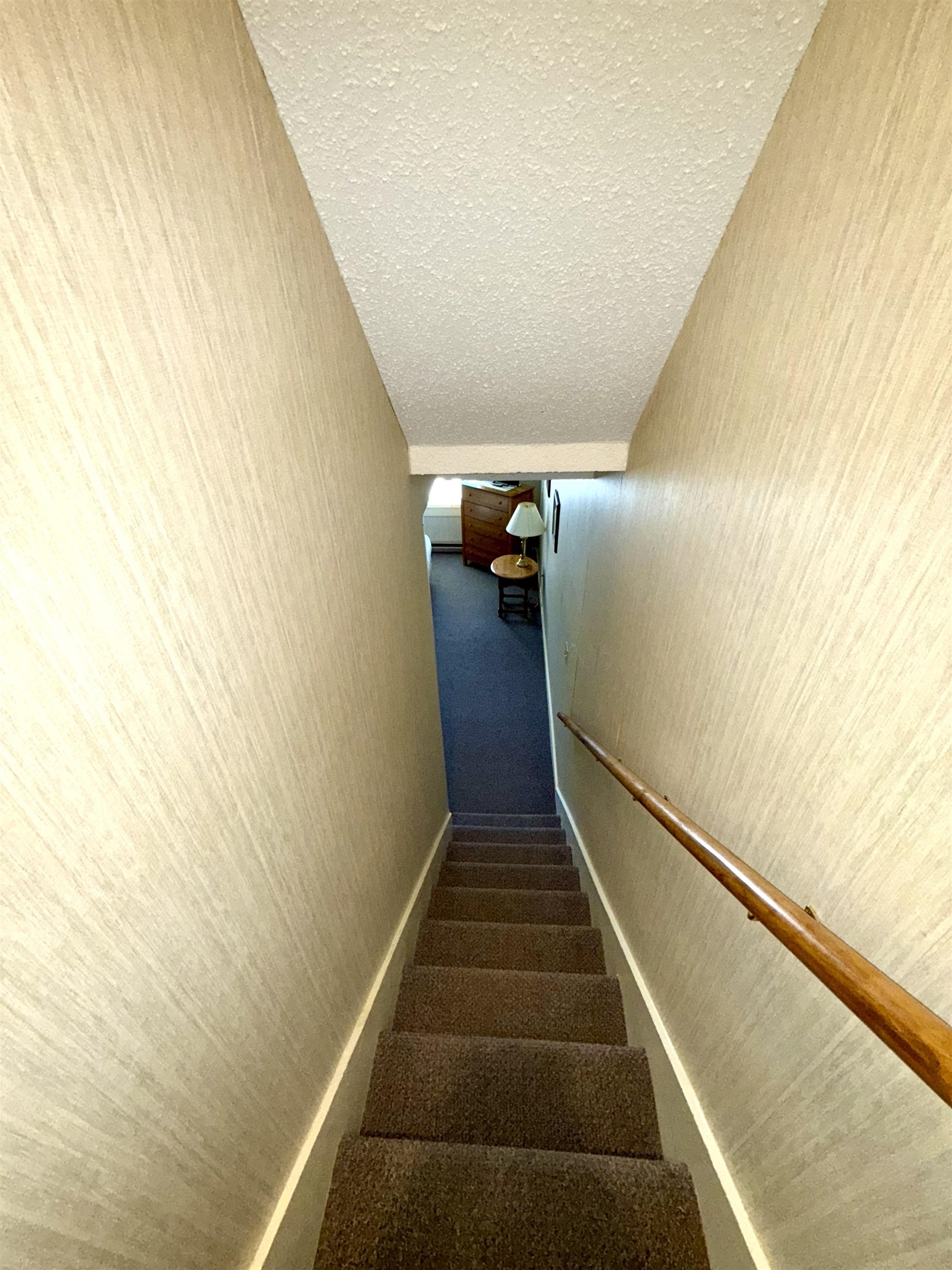 Stairs to lower level Primary bedroom suite