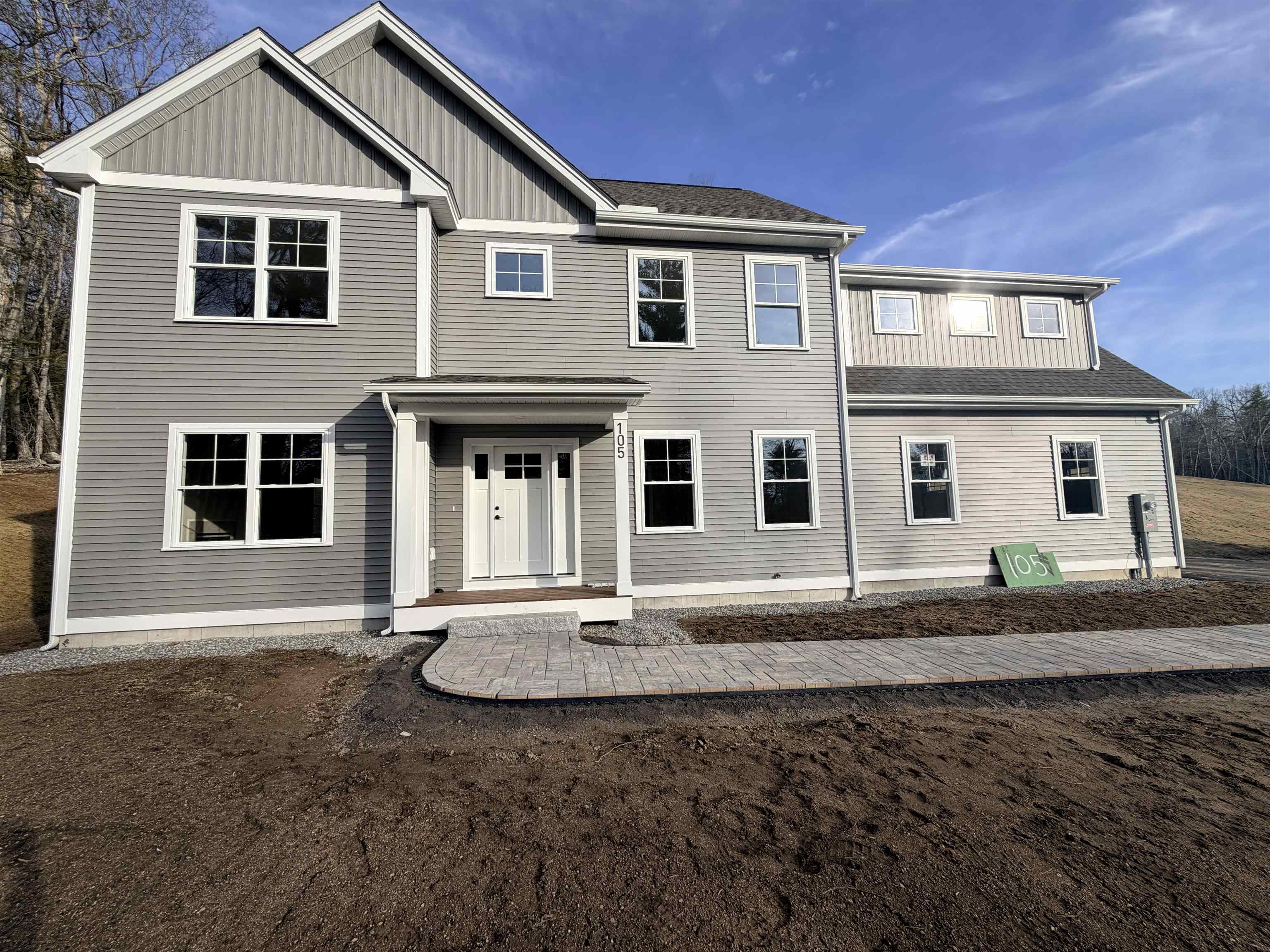 Construction is nearing completion on this ±2,621 square foot Colonial offering four bedrooms, two and a half bathrooms and a thoughtfully designed layout for modern living.  The first floor features 9-foot ceilings and an open floor plan connecting the kitchen, dining, and living areas with a gas fireplace; ideal for both everyday living and entertaining.  The kitchen is well-appointed with quartz countertops, soft-close cabinetry, a tile backsplash, gas stove, under-counter microwave and a hood vent.  Upstairs, Bedrooms 2 and 3 each feature walk-in closets. The primary suite offers a tiled shower, two walk-in closets and a spacious layout with flexibility for a variety of furniture and design options.  Additional highlights include a first floor study, mudroom, second-floor laundry, and a spacious two-car garage.  The unfinished basement provides ample storage and potential for future expansion.  Energy-efficient heating and cooling systems, along with an on-demand water heater, add to the home’s comfort and efficiency.  The exterior features durable vinyl siding, gutters, large energy-efficient Harvey windows and vinyl trim wrapped around the facia, windows and doors, adding to the home's low maintienance appeal.  A stone paver walkway and composite decking further enhances both the entry and overall curb appeal.  Please do not enter the property without an appointment.