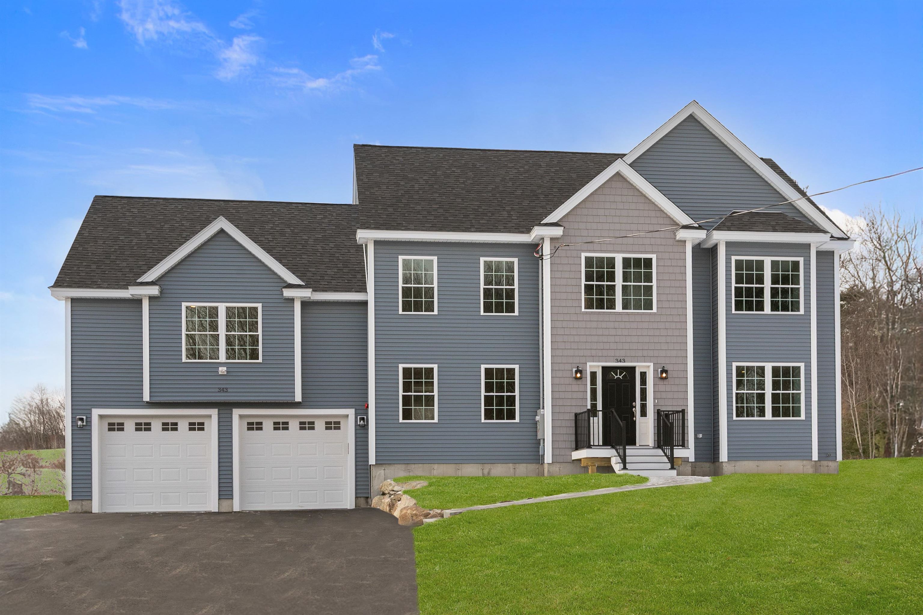 Welcome to this beautiful new construction custom Colonial home in Derry, NH, set on 1.49 acres. This thoughtfully designed 4-bedroom, 2.5-bath residence offers an open-concept layout ideal for modern living and entertaining. The main level features gleaming hardwood floors and a spacious kitchen with a large center island, stainless steel appliances, quartz countertops, and a bright dining area. Sliding glass doors lead to a composite deck, perfect for outdoor dining and relaxation. The first floor also includes a living room, formal dining room, and a half bath. Just a few steps up, above the two-car garage, you’ll find a stunning family room with vaulted ceilings and a cozy gas fireplace—an inviting space to unwind. The second floor offers a generous primary suite with a private bath with a double vanity and tiled shower, along with three additional bedrooms, a full bath with a double vanity, and a conveniently located laundry room. This home features numerous upgrades, including crown molding, shadow box woodwork, modern finishes such as a wine fridge, and so much more—all in a desirable setting. Don’t miss your opportunity to own a brand-new home. Open House on Saturday, April 25th from 1:00PM - 3:00PM.