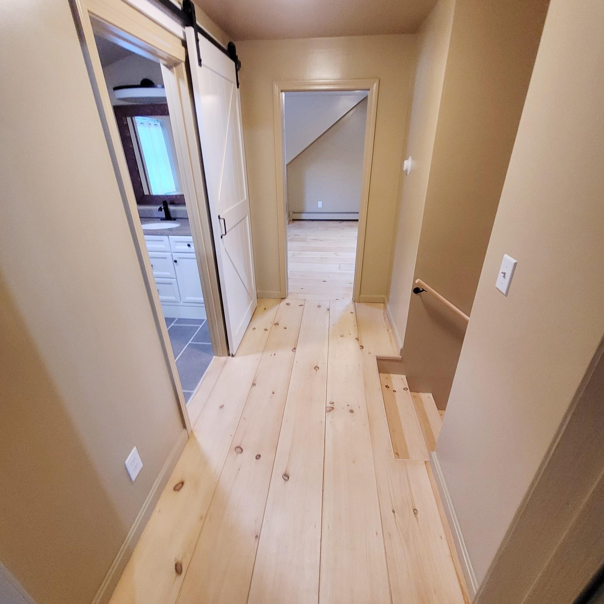 Upstairs hall, barn door to full bath