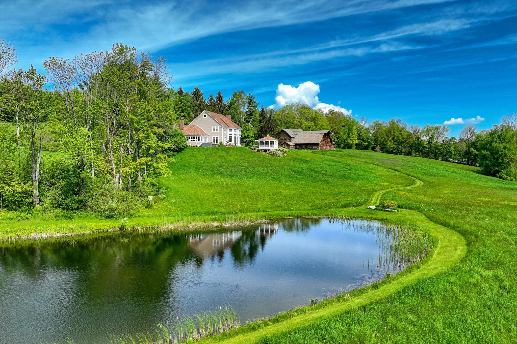 Lovely pond highlights the south end of the property