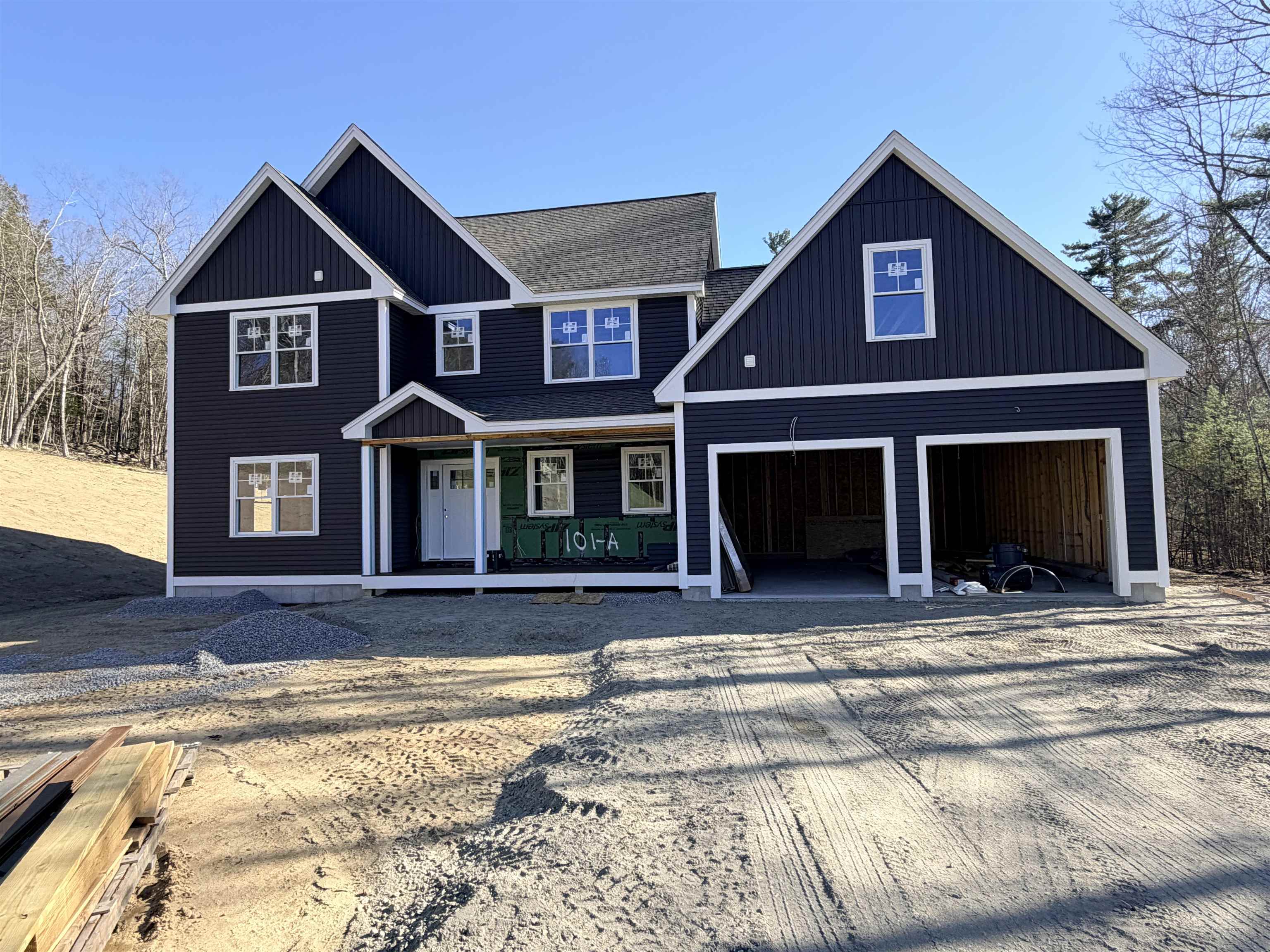 Under Construction in Merrimack, NH. This thoughtfully designed 3,455± square-foot new construction home is situated on a ±3.8 acre lot and offers a spacious layout with a bright, open, and welcoming feel. The main level features 9-foot ceilings, a foyer, a functional mudroom, and a first-floor study or home office, ideal for today’s flexible lifestyles. The open-concept kitchen, living, and dining areas flow seamlessly and are highlighted by a great room with a vaulted ceiling and gas fireplace, creating a sense of scale and natural light that feels both grand and comfortable. The primary bedroom suite, located on the second floor, offers a true private retreat with a well-appointed bath featuring a tiled walk-in shower. Three additional bedrooms, a full bathroom, and a half bath with laundry are also located on the second floor, providing convenient and flexible living space. The walk-up basement with wide staircase and convenient doghouse entry, offers ample storage and potential for future finishing. There is a small window for some buyer selections depending on timing.
