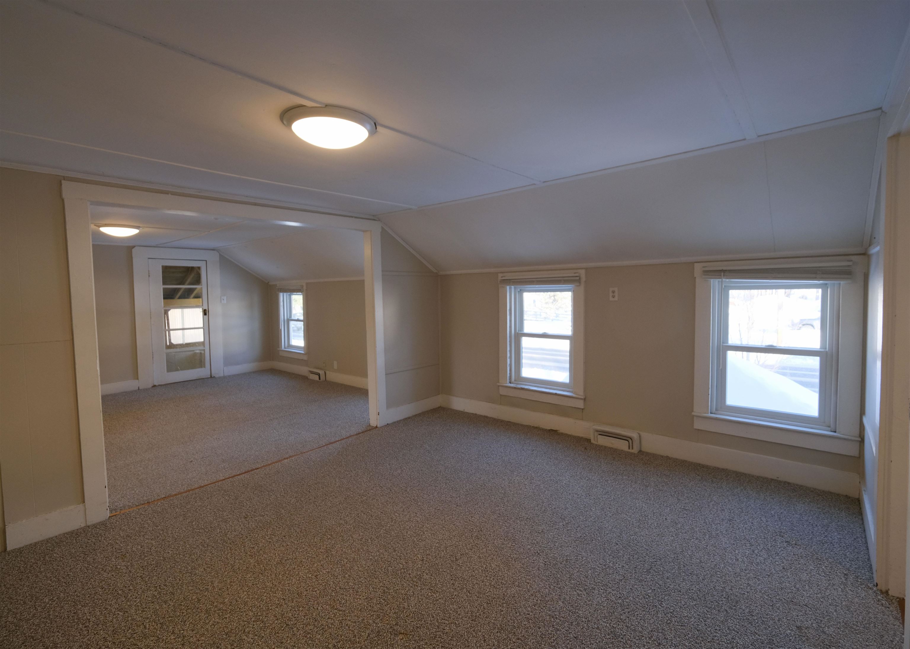 Unit 2 - Living/Dining Rooms - Door to enclosed porch 24660721