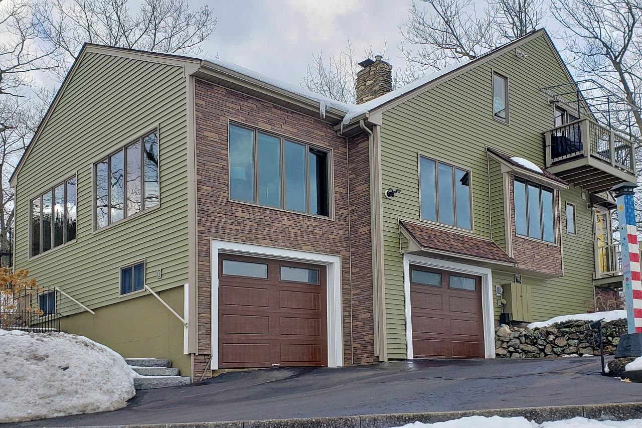 Stunning Lakeside Living on Beaver Lake. Experience the pinnacle of "lake life" in this meticulously maintained home overlooking the serene waters of Beaver Lake. From the professionally renovated kitchen to the designer-updated bathrooms, every inch of this residence has been crafted for comfort and style. The heart of the home features a dramatic open-concept living area with vaulted ceilings and skylights that bathe the space in natural light. Stunning hardwood floors lead you to the private first-floor primary suite—a true sanctuary featuring a walk-in shower, dual vanities, and the luxury of radiant heated floors. Whether you are working from home against a backdrop of the sparkling lake or enjoying your favorite beverage on the private balcony or the patio overlooking the lush gardens, this home offers a daily escape. For the outdoor enthusiast, take your kayak or boat down to the lake access for a day of swimming and boating. Steps away from Gallien’s beach…Location is everything: You are perfectly positioned just minutes from premier shopping, dining, healthcare, and major commuter routes. Don’t just dream about the lake—live it. Schedule your private tour TODAY! OPEN HOUSE Saturday, February 28th from 1-3 pm. Come see what "lake life" is all about! Join us for a tour of this beautiful home—we can’t wait to show you around and answer any questions. See you at the lake!