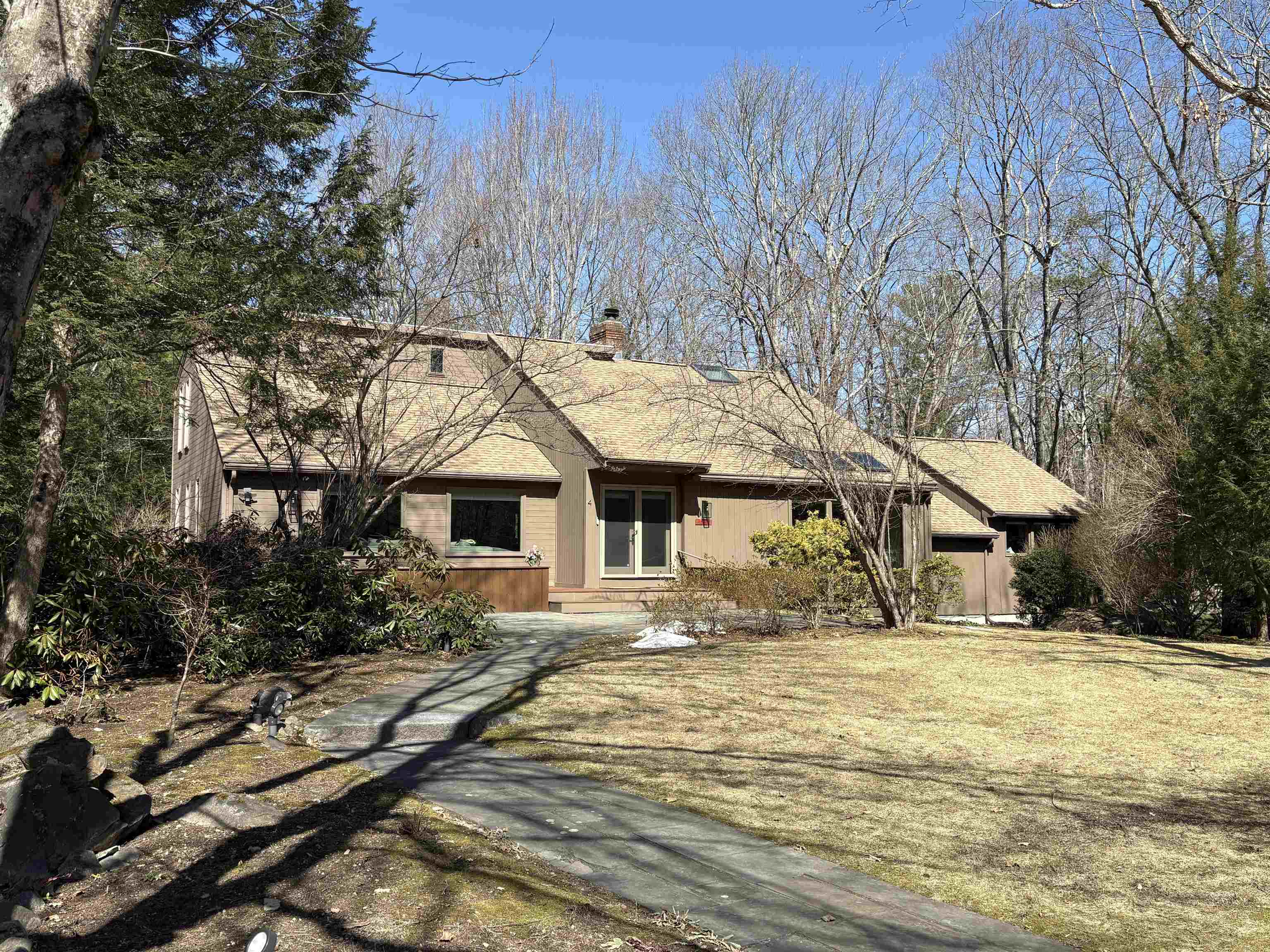 Truly One of Londonderry's Best! Discover an exceptional custom-built contemporary home, beautifully updated & meticulously cared for over the past four decades. From the moment you enter, it’s clear that this residence offers a unique blend of thoughtful design, quality craftsmanship, and modern comfort. This expansive property provides remarkable flexibility, including 2 potential primary suites—one on both first floor and second floor, each featuring a custom oversized full bathroom and generous walk-in closet. With 3–4 plus potential bedrooms, multiple additional rooms ideal for offices or creative spaces, and  the layout adapts easily to a wide variety of lifestyle! The gourmet, updated kitchen is a standout feature, designed to impress with its custom finishes, expansive breakfast bar, and abundant workspace perfect for everyday living or hosting memorable gatherings. The adjoining two-story family room showcases a striking fireplace and large windows that fill the space with natural light, creating a warm and inviting atmosphere. Convenience continues with central air conditioning, a first-floor laundry room, and a blend of quality wood, tile, and carpeted flooring throughout the home. Recent improvements include a newer roof and a newly installed on-demand propane generator, adding peace of mind and efficiency. Outdoor living is just as impressive, featuring a spacious 700 sq ft private deck and an inviting front patio—ideal for relaxing & entertaining! Numerous thoughtful updates throughout the home contribute to its move-in-ready feel, offering the character of a long-loved property with the freshness of one that feels newly built. Enjoy the charm and warmth of wood and soaring ceiling!  The current owners have cherished this remarkable home for many years, and now it is ready to welcome its next chapter. Come see all the possibilities and discover the comfort, function, and style this property offers. Showing begin @ O.H. 3/7 + 8, from 12-2 Sat & Sun