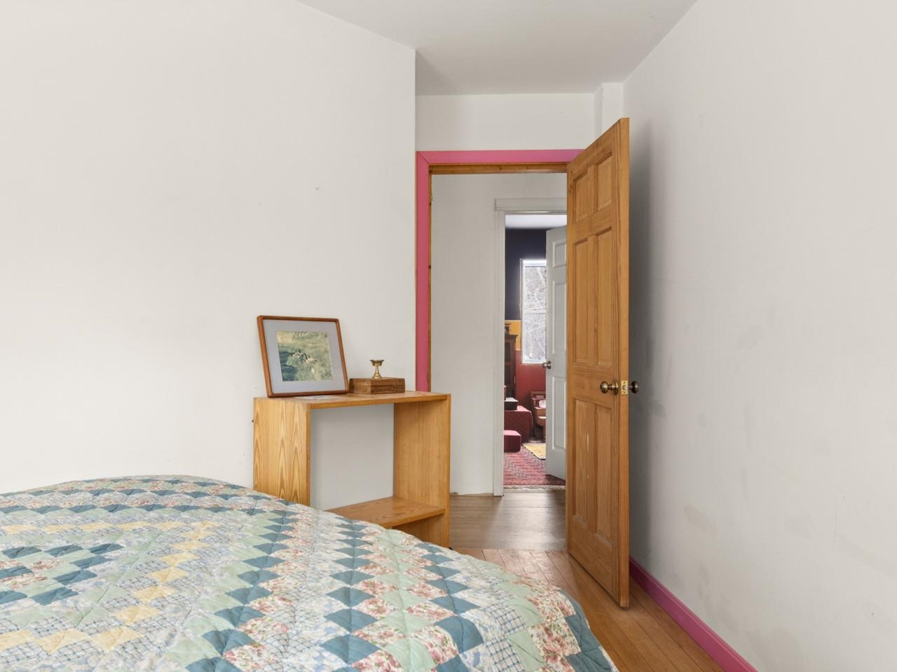 Cozy bedroom with wood floor