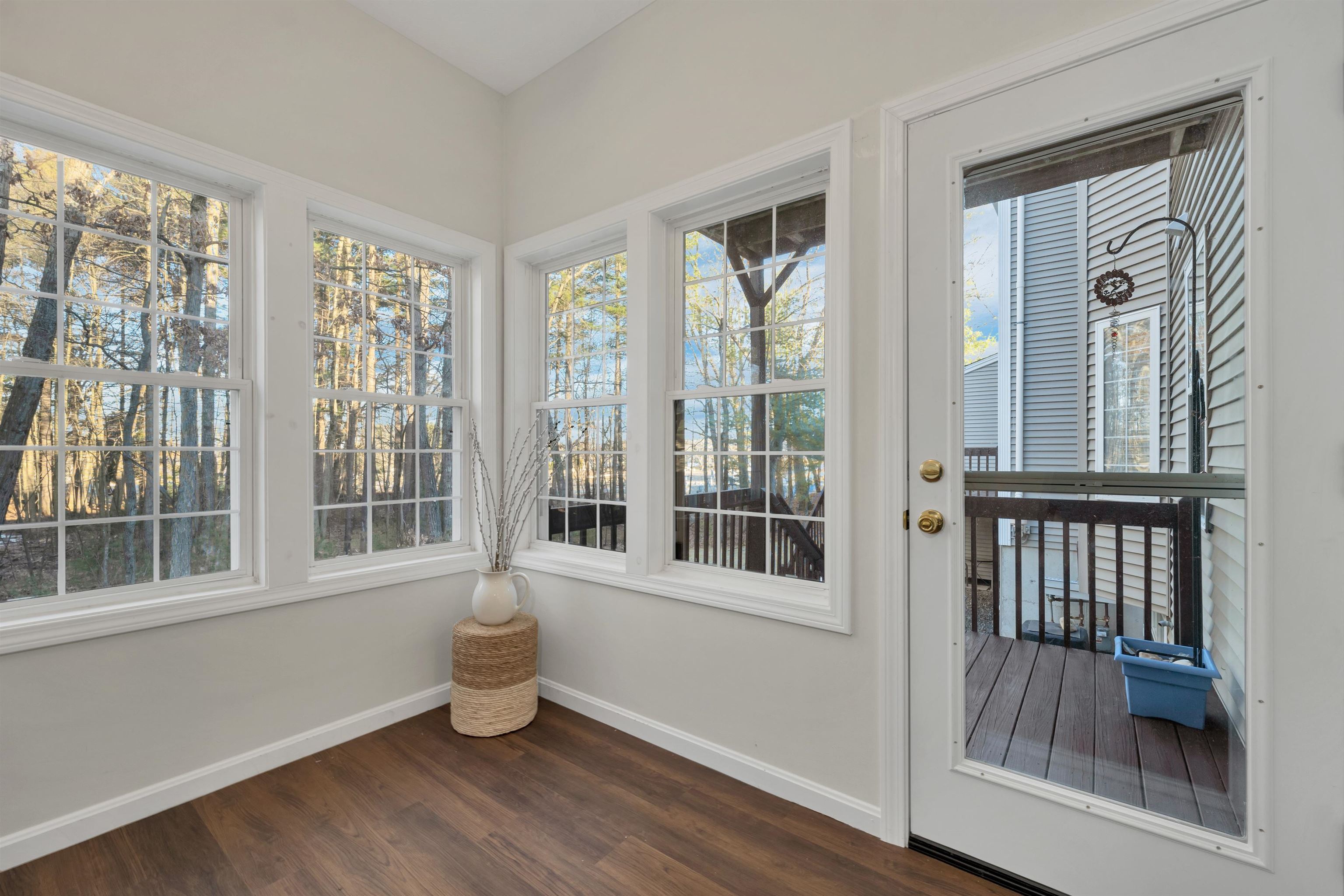 Door to the deck from sunroom is new