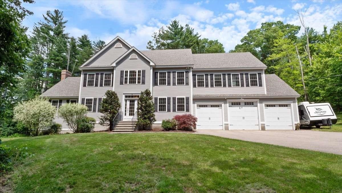 Cobbetts Pond Area Home on 1.87 Acres | 4,254 Sq Ft | Gourmet Kitchen | Theater Located approximately 300 yards from Cobbetts Pond, this 4-bedroom, 3.5-bath home offers 4,254 sq ft of finished above-grade living space on a private 1.87-acre wooded lot with seasonal views of the pond. The home features a spacious layout designed for both everyday living and entertaining, anchored by a gourmet kitchen with center island, walk-in pantry, and custom cherry cabinetry, with seamless flow into the main living areas. Hardwood floors, natural light, and a handcrafted masonry wood-burning fireplace add warmth and character. A standout feature is the finished walk-up attic, currently configured as a dedicated theater and game room—creating a distinct entertainment space not commonly found in similar homes. The primary suite includes a custom bath and a separate bonus room ideal for a home office, private gym, nursery, or additional closet space. Two additional bedrooms feature walk-in closets, including one with a private en suite bath and another with direct access to a shared hall bath. The walkout lower level includes a bathroom and radiant heat rough-in. Radiant heat is also roughed in within the 3-car garage. Set back from the road and located near Griffin Park with convenient access to I-93, this property offers a combination of space, comfort, and proximity to Cobbetts Pond in an established Windham setting.