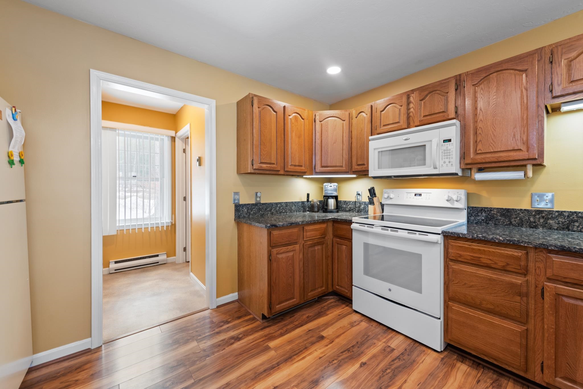 Right off the kitchen is the washer and dryer and a half bath for guests