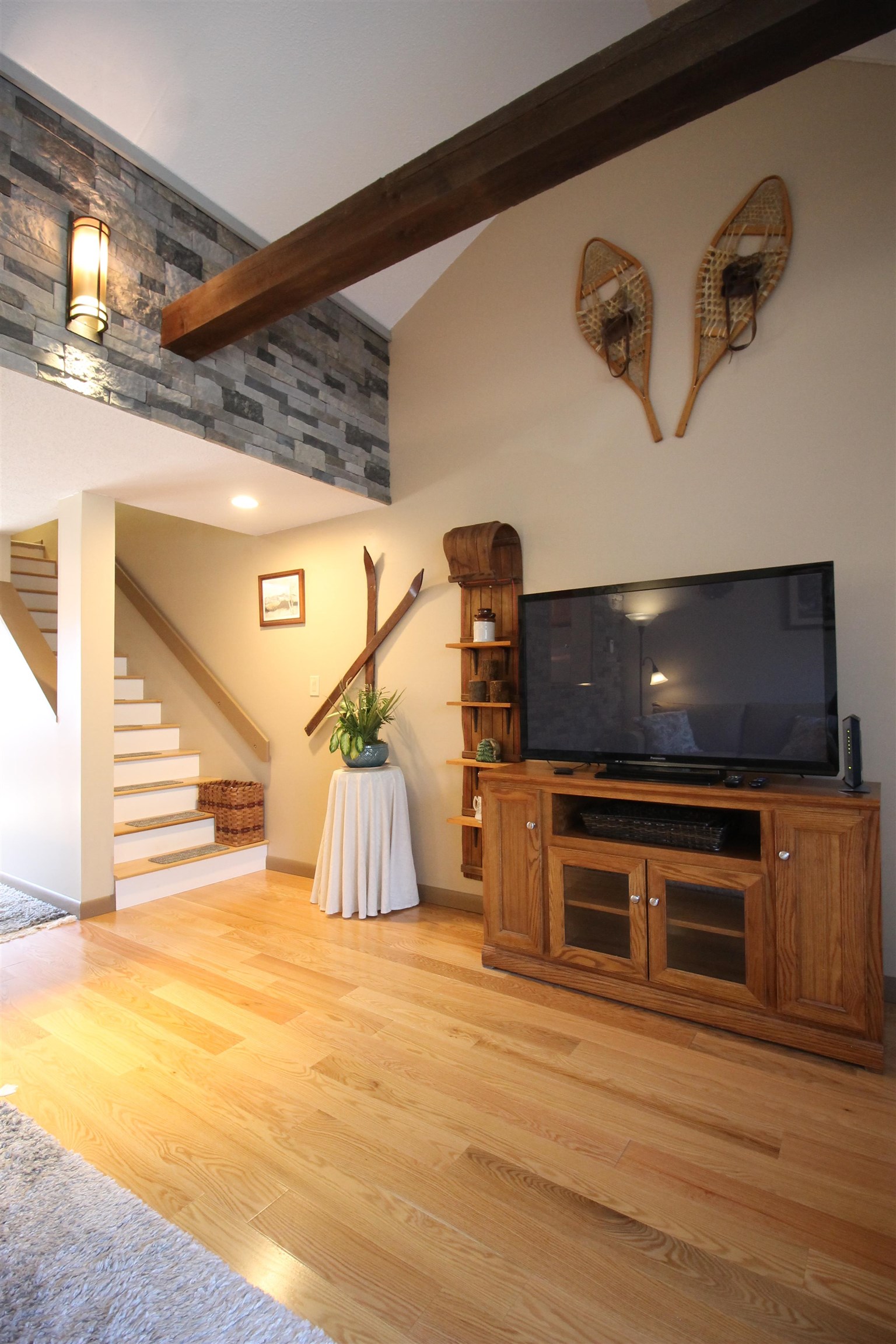 Hardwood on the living level and rustic decor will stay