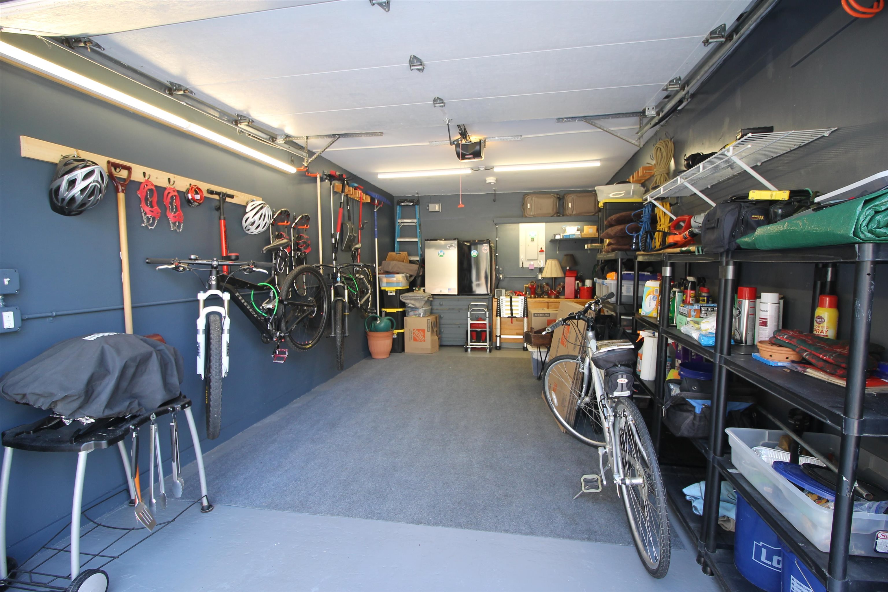 Beautifully updated 1 car garage with many items of value staying