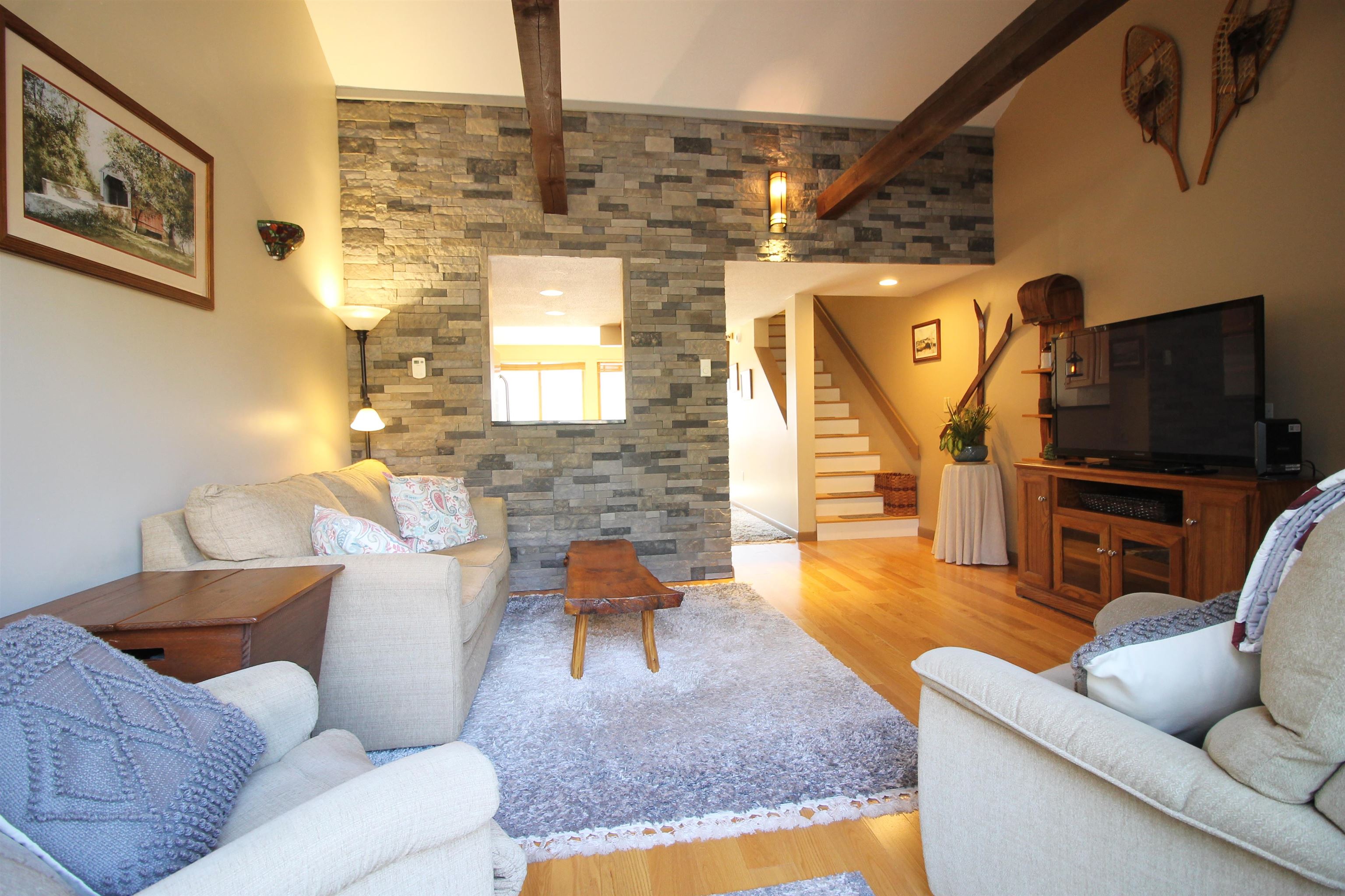 Gorgeous stone accent wall with cathedral ceilings