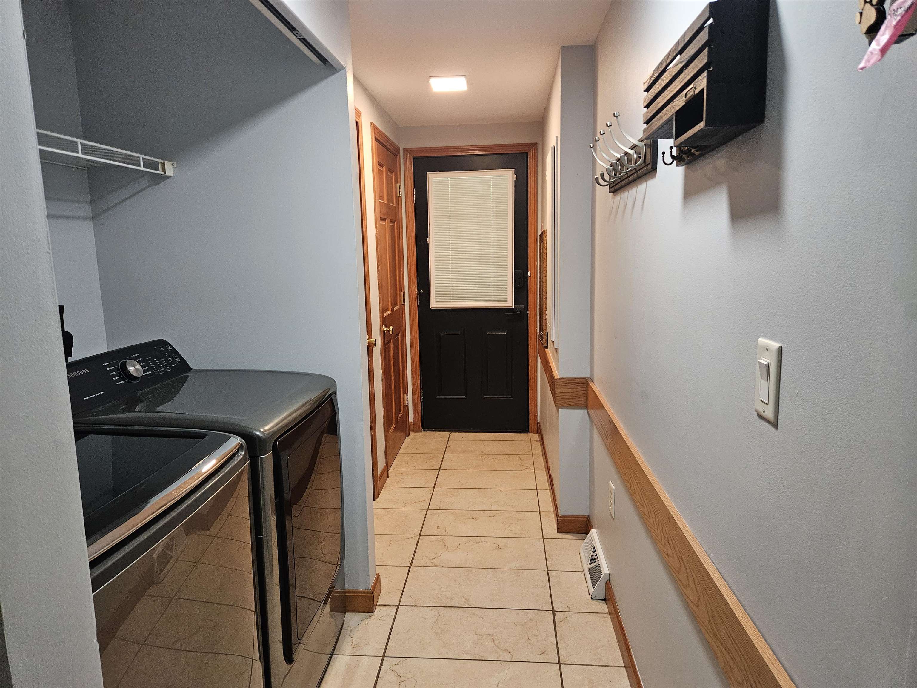 From kitchen looking at side entry with laundry room