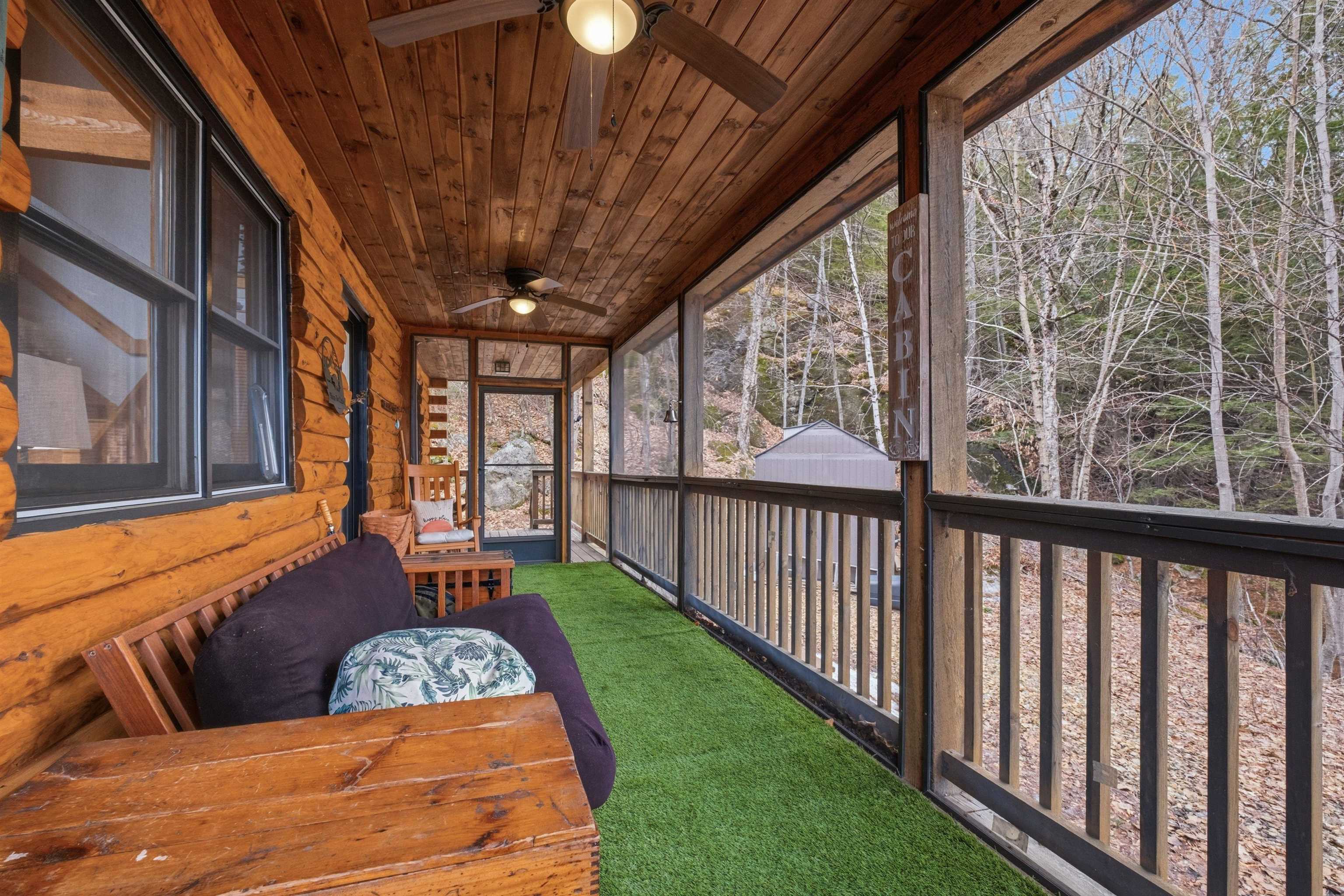 Screen Porch with view of wooded 5 acres