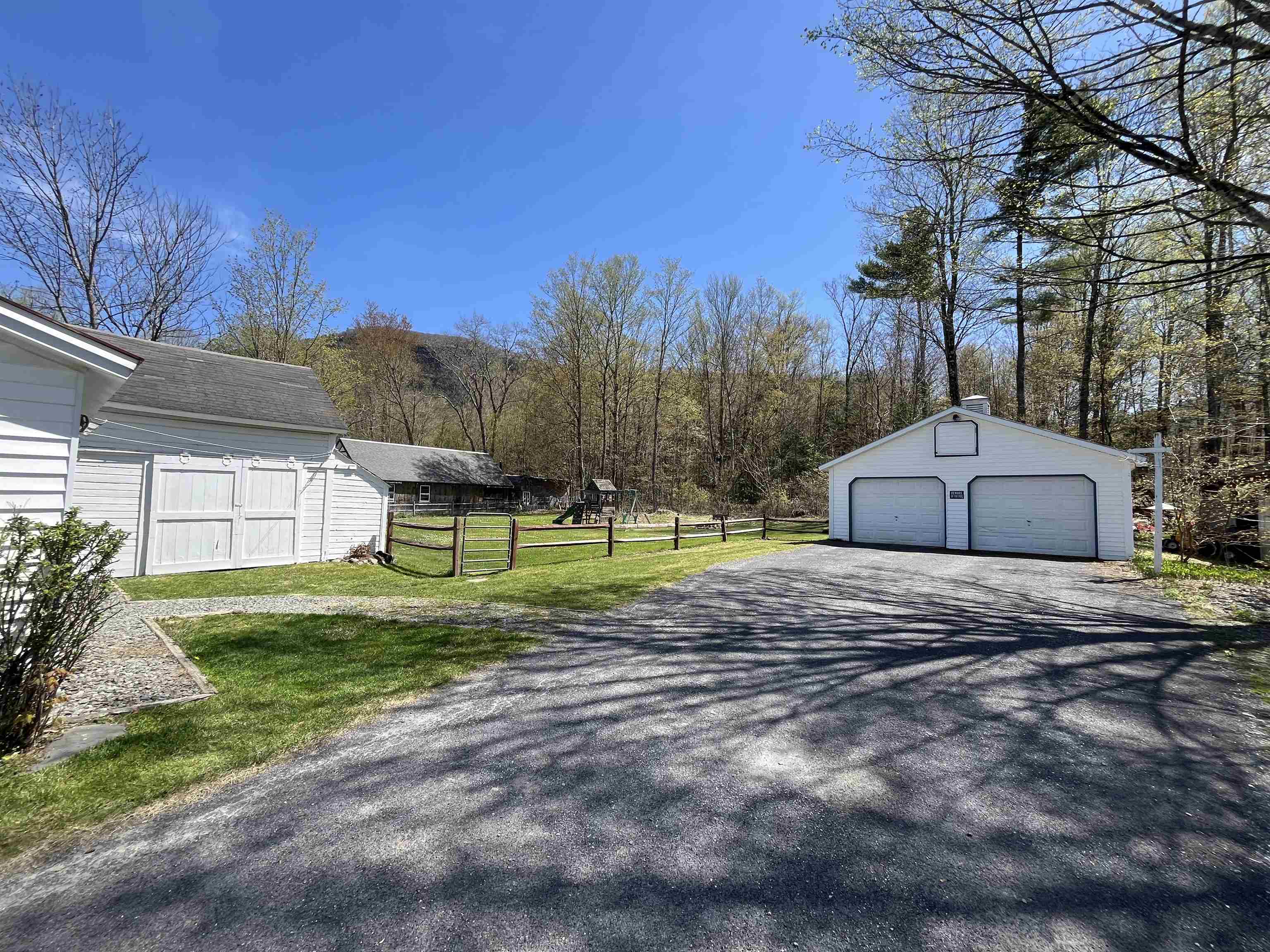Fenced in backyard, paved drive and 2-car garage