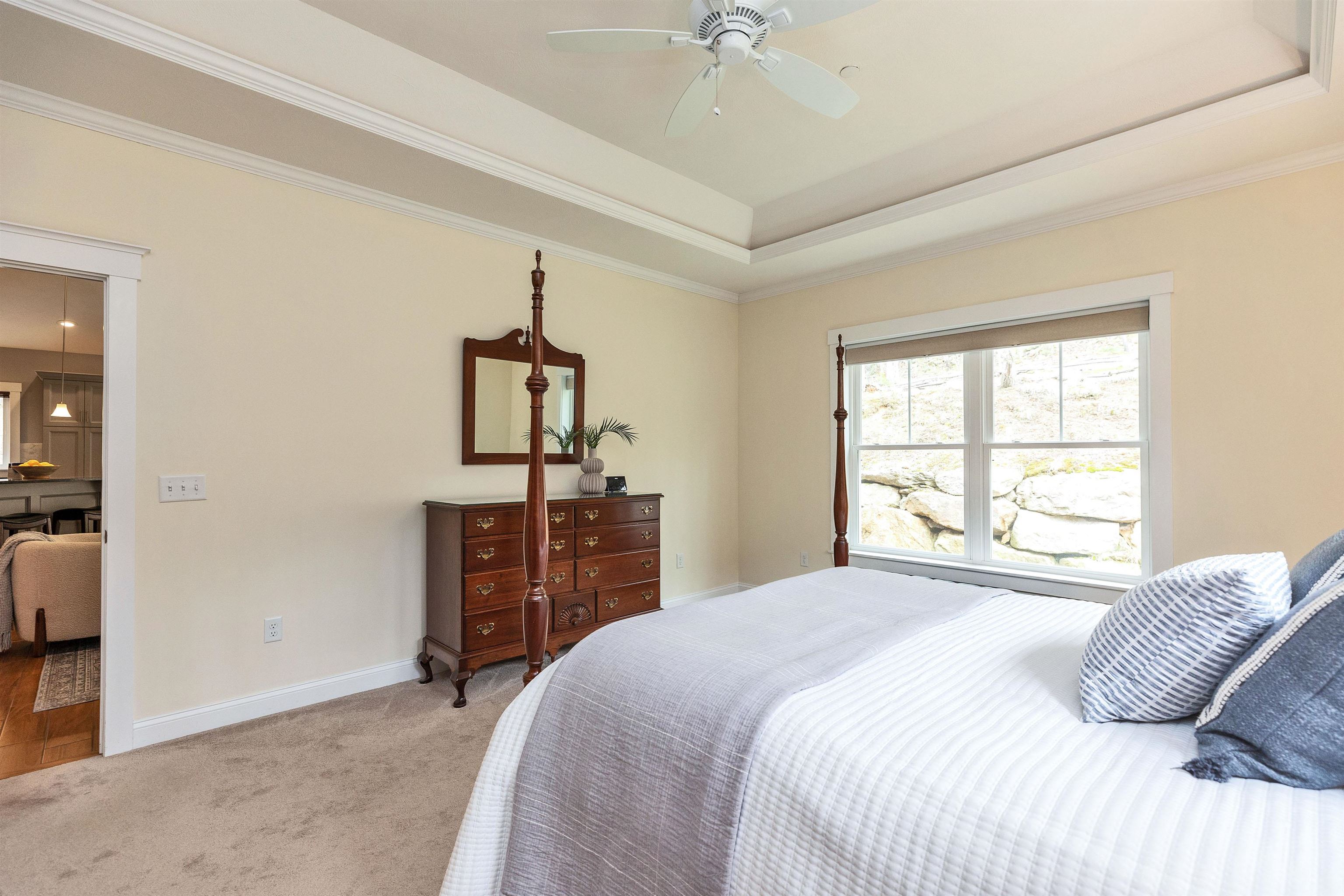 Elegant tray ceilings add architectural detail and sophistication.
