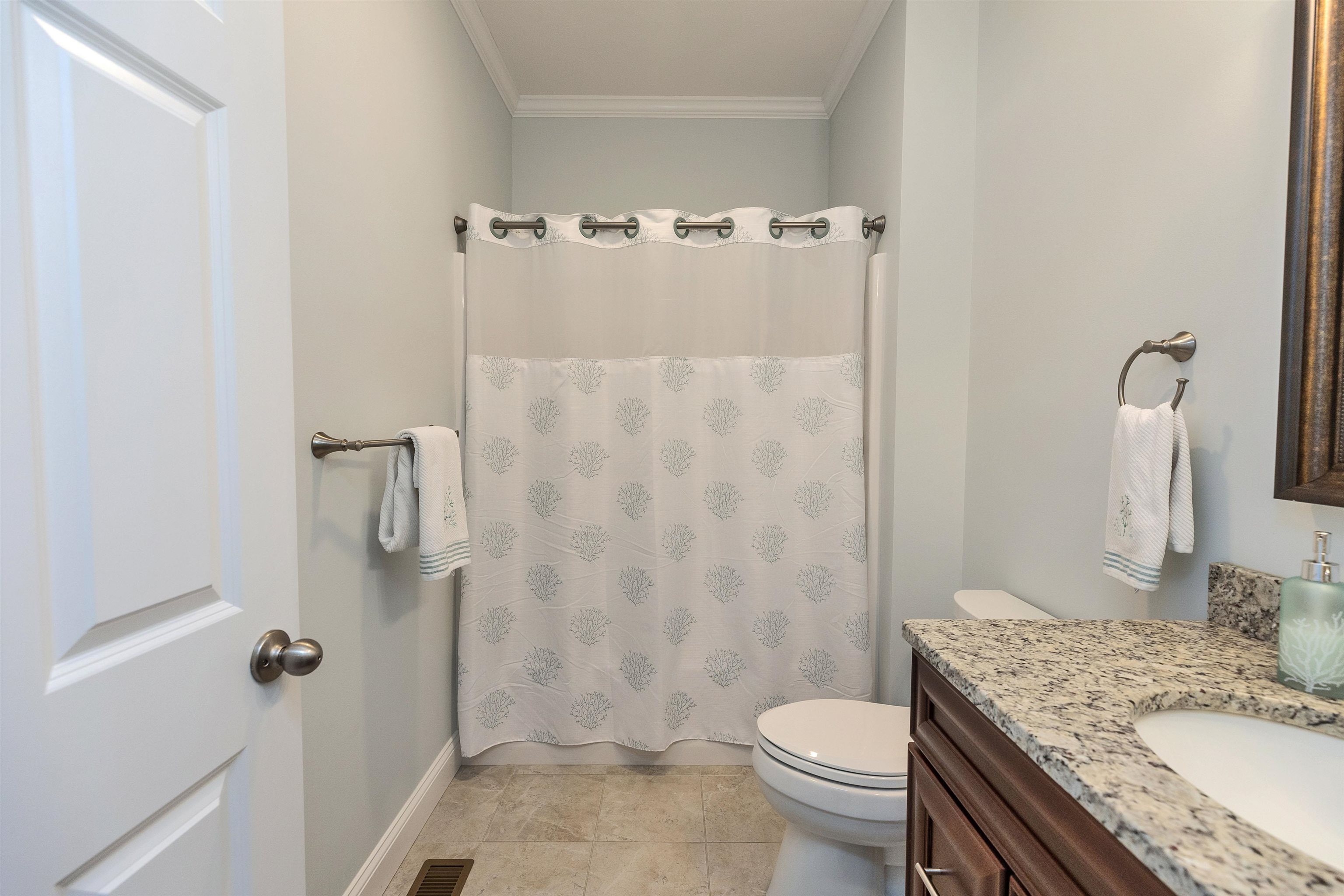 Full bath conveniently located next to the second bedroom.