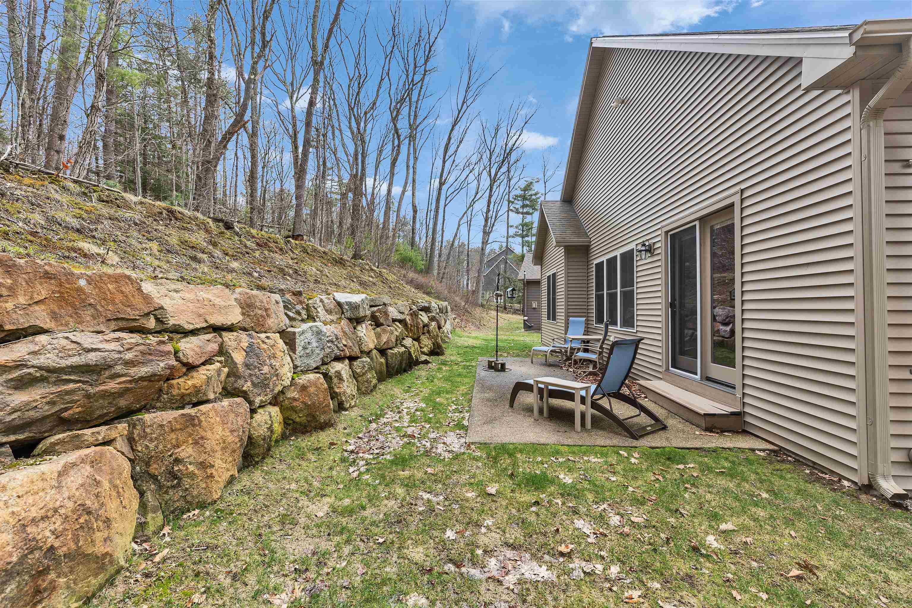 Classic stone walls frame the patio with timeless charm.