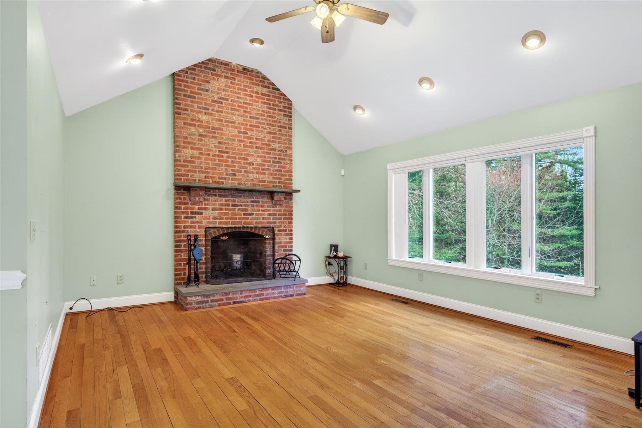 Living room with wood burning fireplace