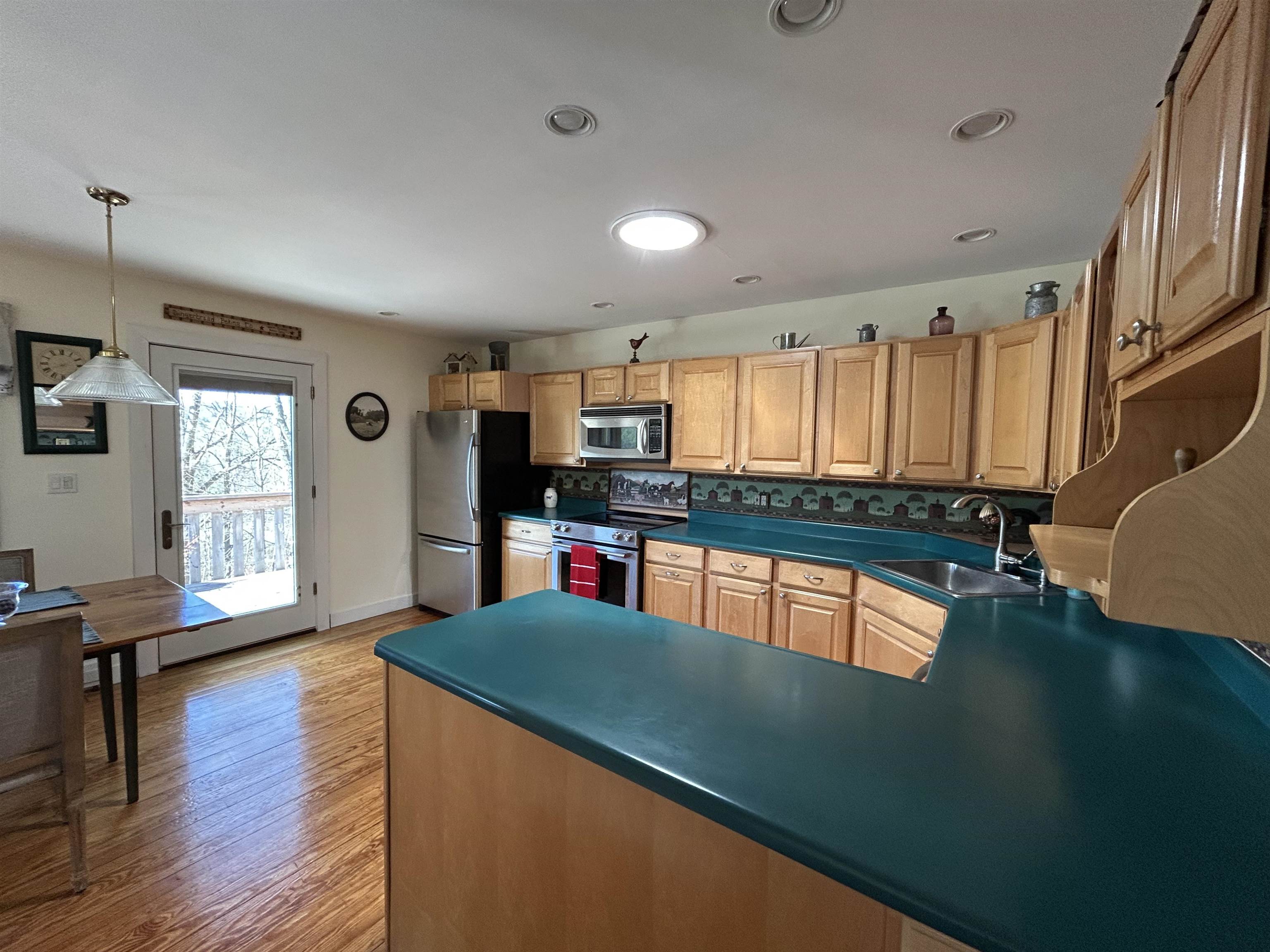 Kitchen, opens to deck. 25053065