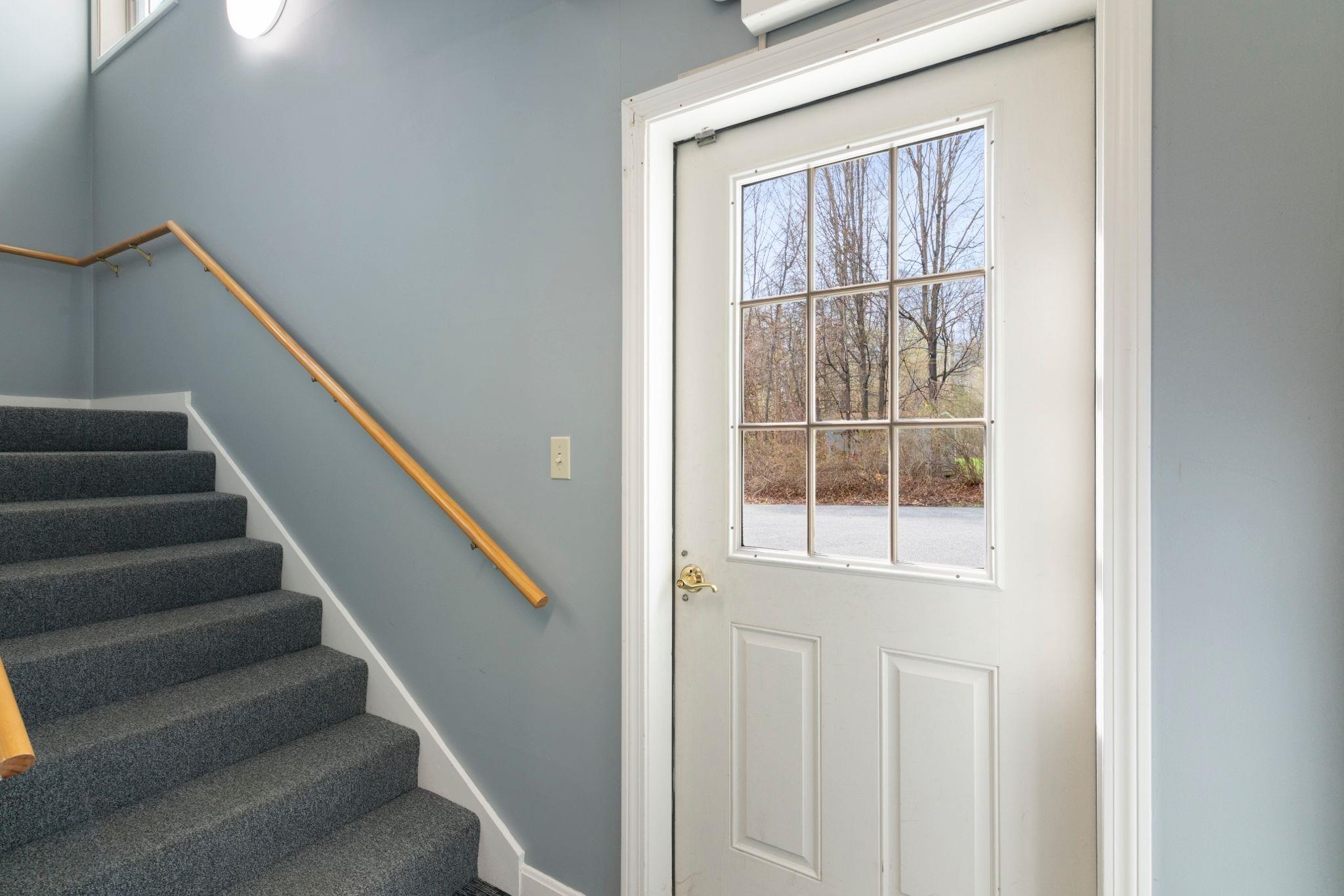 Door out to level parking lot.