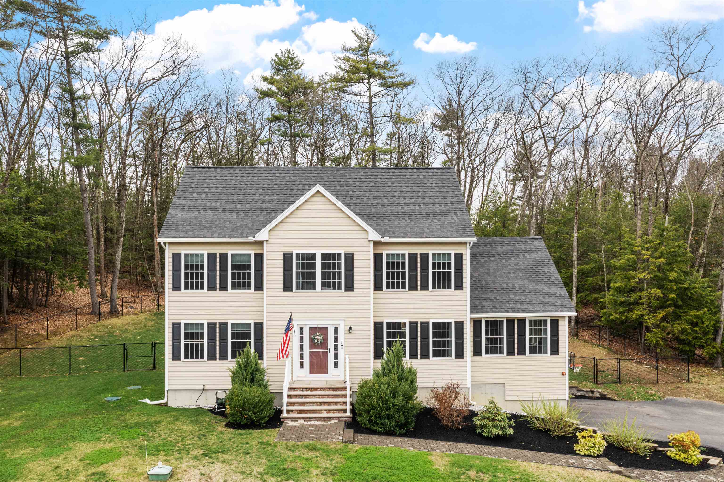 Welcome to this beautiful 4-bedroom, 3-bath Colonial set on a private 3-acre lot surrounded by peaceful woods and fully fenced for added privacy. Built in 2018, this home feels like new construction and has been thoughtfully updated, including a newly finished basement in 2020 and stylishly upgraded bathrooms in 2024. Inside, you’ll find a bright and inviting layout designed for both everyday living and entertaining. The stunning kitchen flows seamlessly into the family room and opens out to a large back deck—perfect for gatherings or simply enjoying the serene backyard. Additional highlights include hardwood floors throughout, a cozy gas fireplace, a finished basement offering extra living space, a water filtration system, and a spacious 2-car garage. The expansive attic provides exciting potential for future expansion or additional rooms. Tucked away in a quiet neighborhood just minutes from Salem and Windham, this move-in ready home offers the perfect blend of comfort, privacy, and convenience. Come experience everything it has to offer! Delayed showings until the open house on Saturday April 25th & Sunday April 26th, 10-12pm.