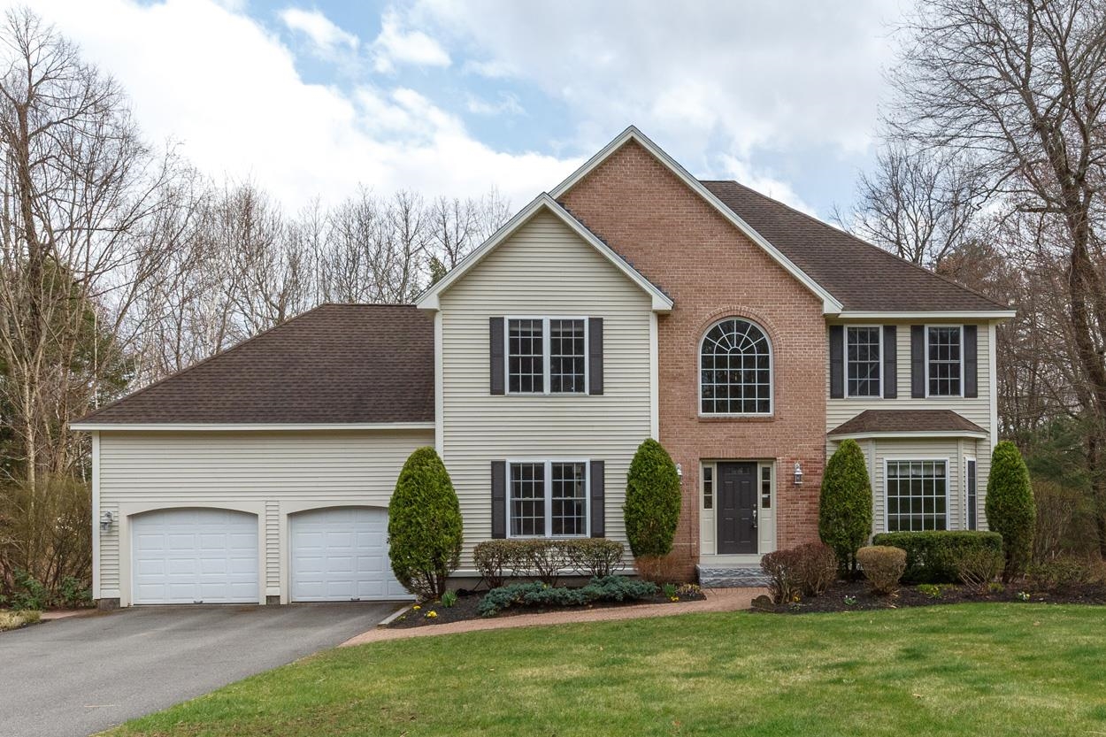 Finally, a full-featured Colonial in the well-established Nottingham Woods subdivision in Windham. This well-maintained home offers four full levels of living space, providing exceptional flexibility and room to grow. On the main floor, an oversized center-entrance layout flows seamlessly from the foyer to the dining room and into the open-concept eat-in kitchen and family room. This level also includes a laundry area, den or front office, half bath, and pantry. The family room is highlighted by a beautiful stone-faced hearth with a gas insert fireplace. Upstairs, you’ll find four generously sized bedrooms, including a standout primary suite with an updated bath, walk-in closet, and versatile bonus room—perfect for a nursery or, fitness space, or expanded closet. The primary suite also offers access to a walk-up attic, ideal for a home office, or workout area. The finished lower level walk out features a spacious bonus area ideal for a recreation room. With its adaptable layout and abundant space, this home offers endless possibilities to suit your lifestyle. Just mins to Rt 93, the Windham golf course, Windham Rail trail and shopping! Schedule your appointment today or visit the open houses this Saturday and Sunday from 10 AM to 12 PM.