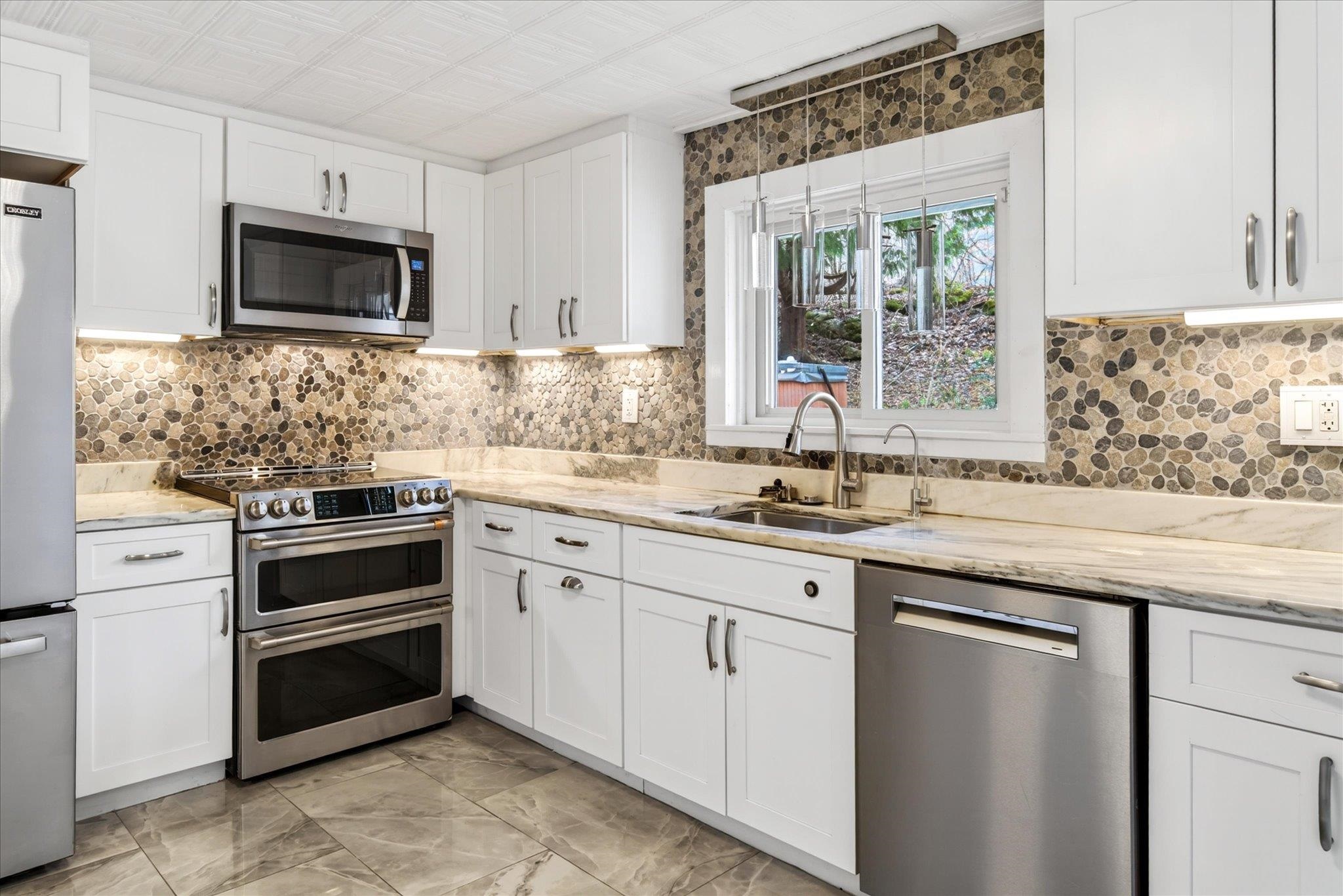 Riverstone back splash & marble counter tops
