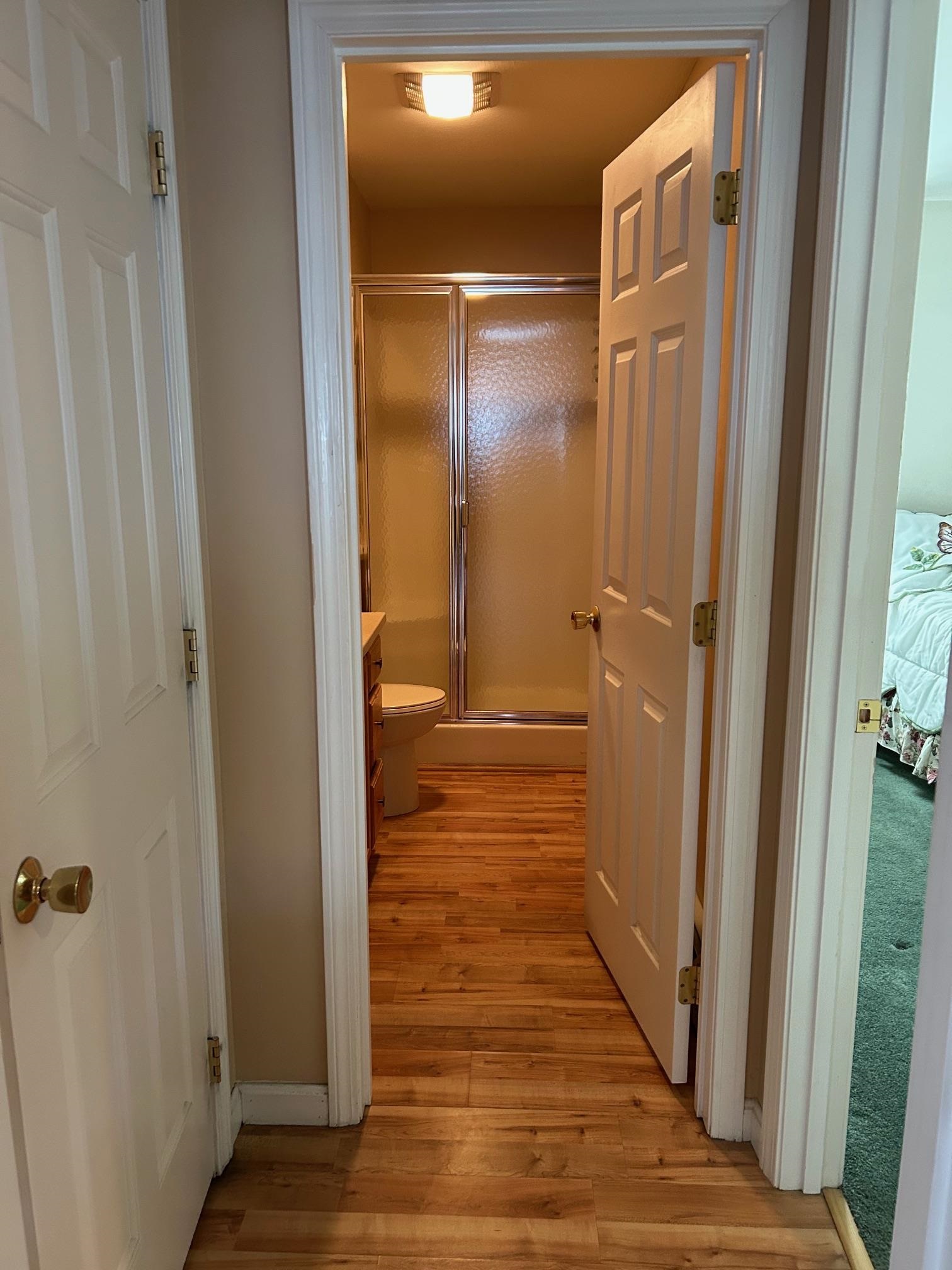 Main Floor Bathroom with Bedroom on right